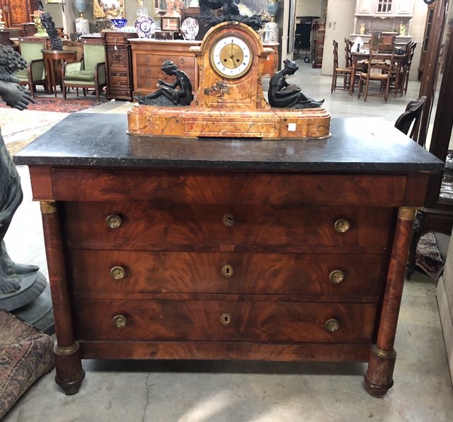 FRENCH EMPIRE FLAME MAHOGANY FRONT MARBLE TOP COMMODE: FRENCH EMPIRE FLAME MAHOGANY FRONT MARBLE TOP COMMODE HAVING INVISIBLE FRAMED UPPER DRAWER OVER 3 GRADUATING HANDLED DRAWERS WITH GILT BRONZE CAPITAL COLUMN SUPPORTS, 19TH C.; 37"H X 51"W X 25"D; COND