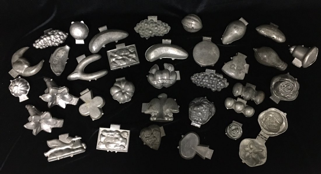 GROUP OF 34 PEWTER CHOCOLATE AND ICE CREAM MOLDS: GROUP OF 34 PEWTER CHOCOLATE AND ICE CREAM MOLDS OF ASSORTED SHAPES AND FORMS