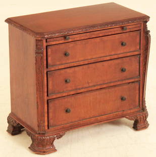 MINIATURE ENGLISH WILLIAM KENT INSPIRED CHEST: MINIATURE ENGLISH WILLIAM KENT INSPIRED CHEST HAVING CANTED CORNER CARVED TOP WITH BRUSHING SLIDE AND GRADUATING DRAWERS FLANKED BY ANCANTHUS SCROLL CARVED COLUMNS RESTING ON ENRICHED TREATED OGEE BRA