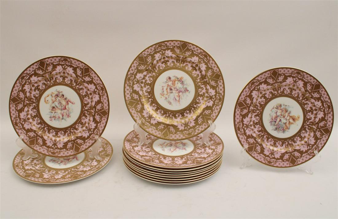 SET OF 12 SEVRES STYLE PORCELAIN PLATES: SET OF 12 SEVRES STYLE PORCELAIN PLATES HAVING PINK AND GOLD BORDERS WITH MYTHOLOGICAL FIGURES IN CENTER VIGNETTES AND FAUX MARK ON REVERSE IN BLUE; 10.5"DIA.