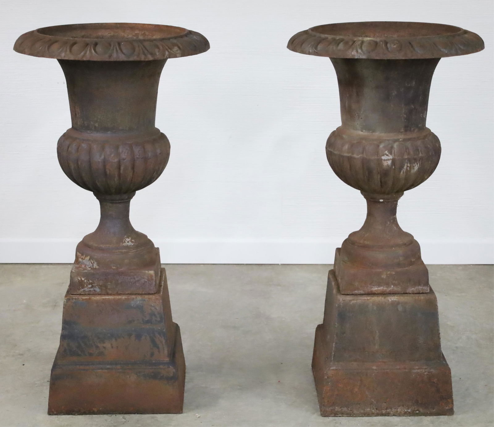 Pair of Classical Cast Iron Style Urns on Stands (1 of 4)