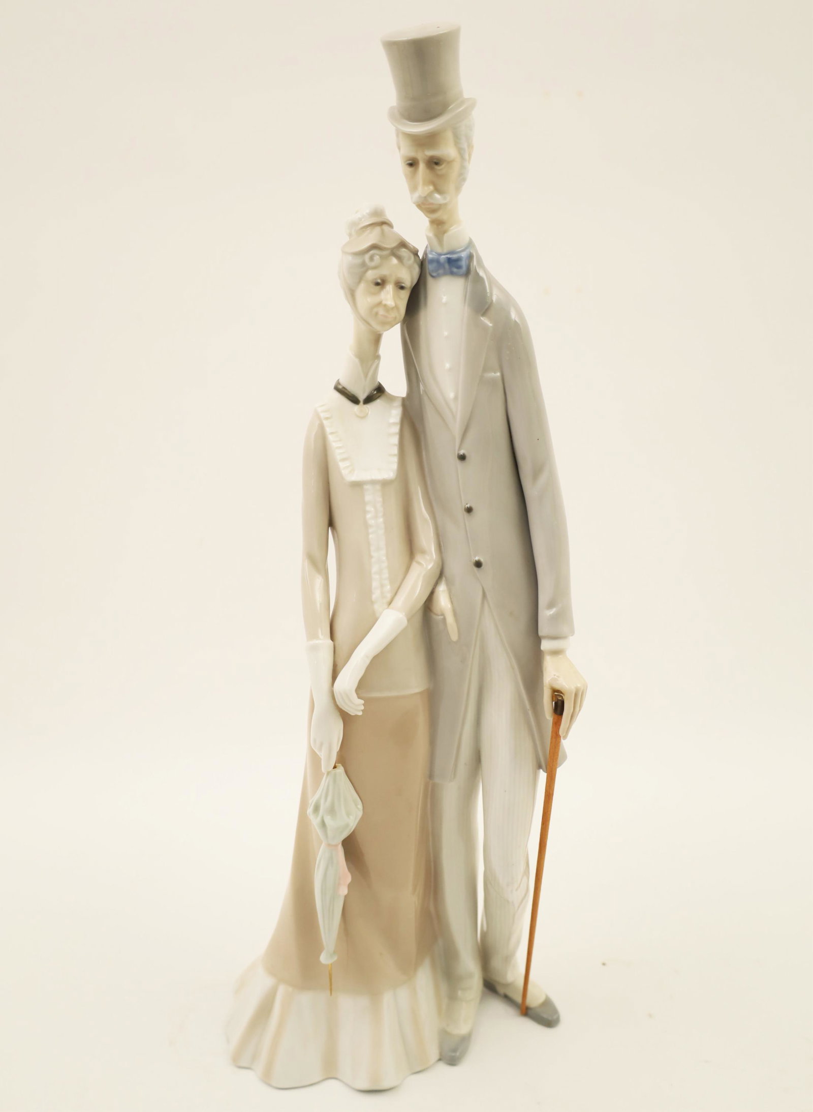 Lladro Porcelain Model of Couple: Lladro porcelain figure, Old Age Couple, designed by Julio Fernandez, retired in 1985, maker's mark underfoot; 19.5"H