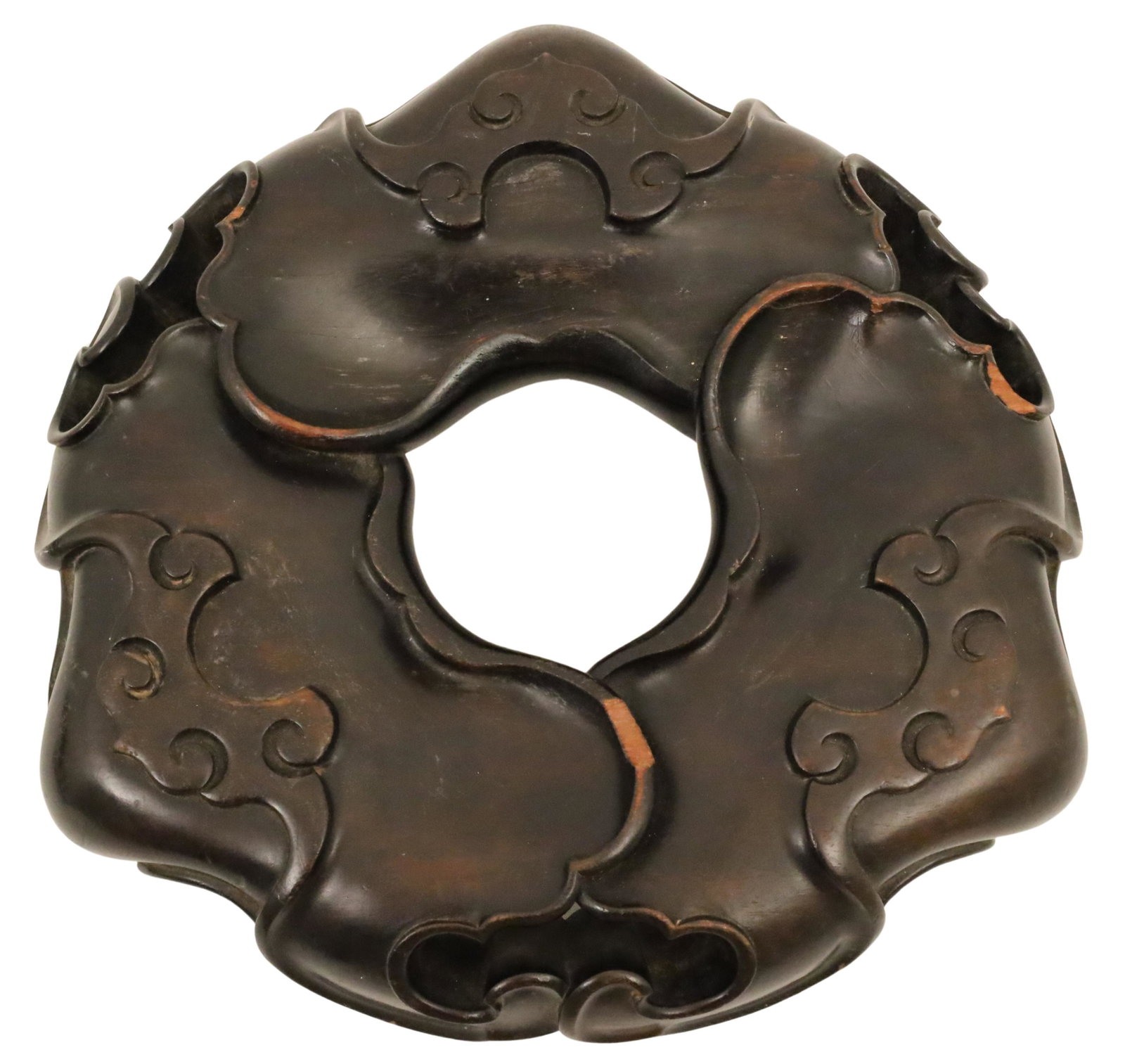 CHINESE CARVED ZITAN LONGEVITY TOTEM: Chinese carved zitan totem, circular design with open center portal and decorated with sacred bats and clouds, said to bring longevity and good luck, resting on trifid feet; 3"H 11"Dia