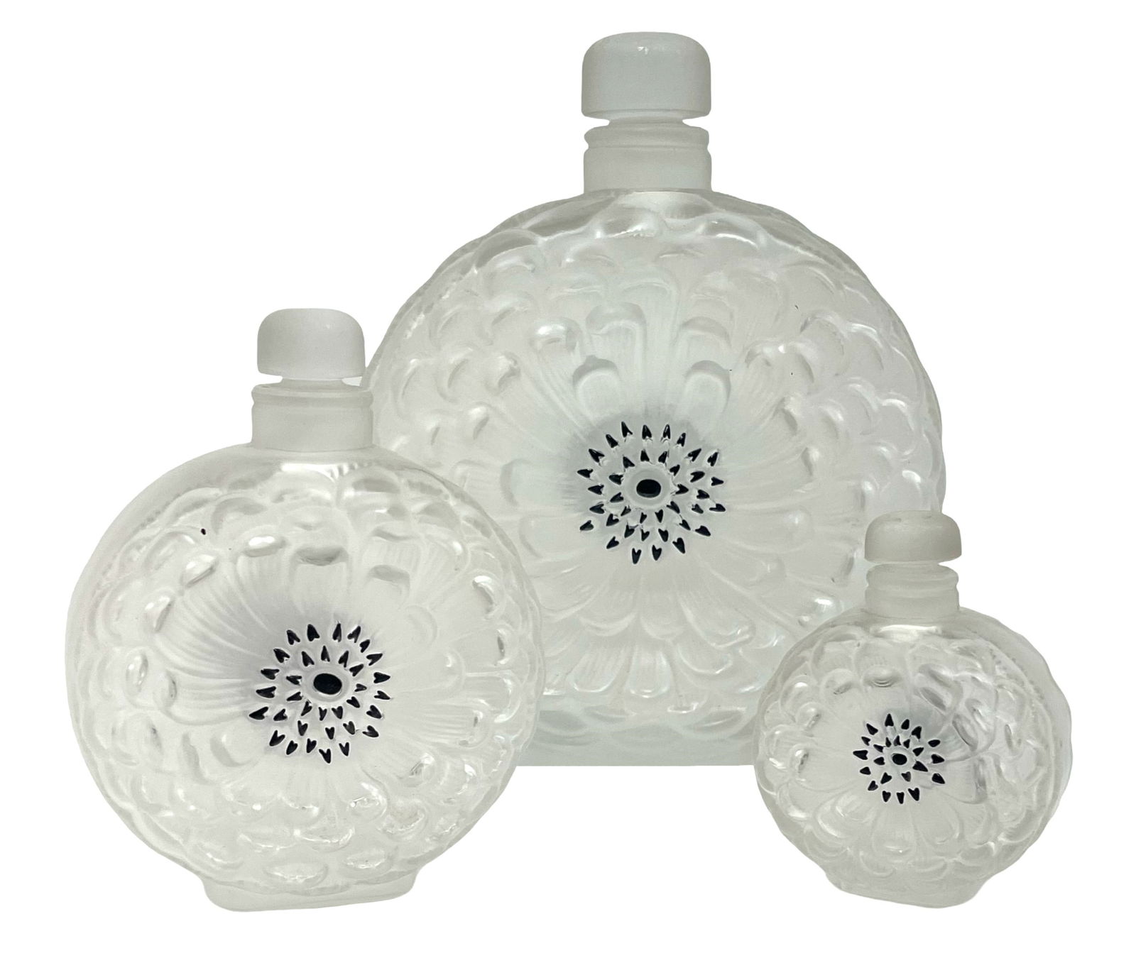 GRADUATING SET OF 3 LALIQUE FLASKS: Graduating set of 3 French signed Lalique crystal capped circular formed frosted crystal flasks. 8"x6.75" x 3"