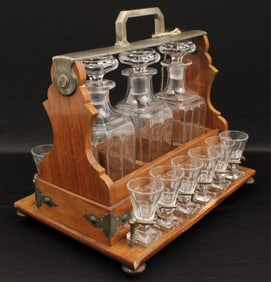 ENGLISH ART NOVEAU PERIOD OAK TANTALUS SET