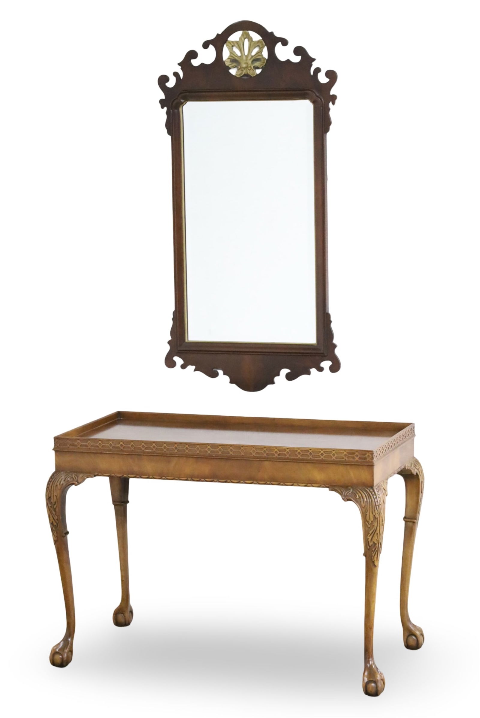 CHIPPENDALE STYLE CONSOLE AND MIRROR: Chinese Chippendale style console table with fretwork gallery top, ancathus carved knees on cabrole legs, resting on ball and claw feet, along with a Georgian style mahogany and parcel gilt mirror, 20