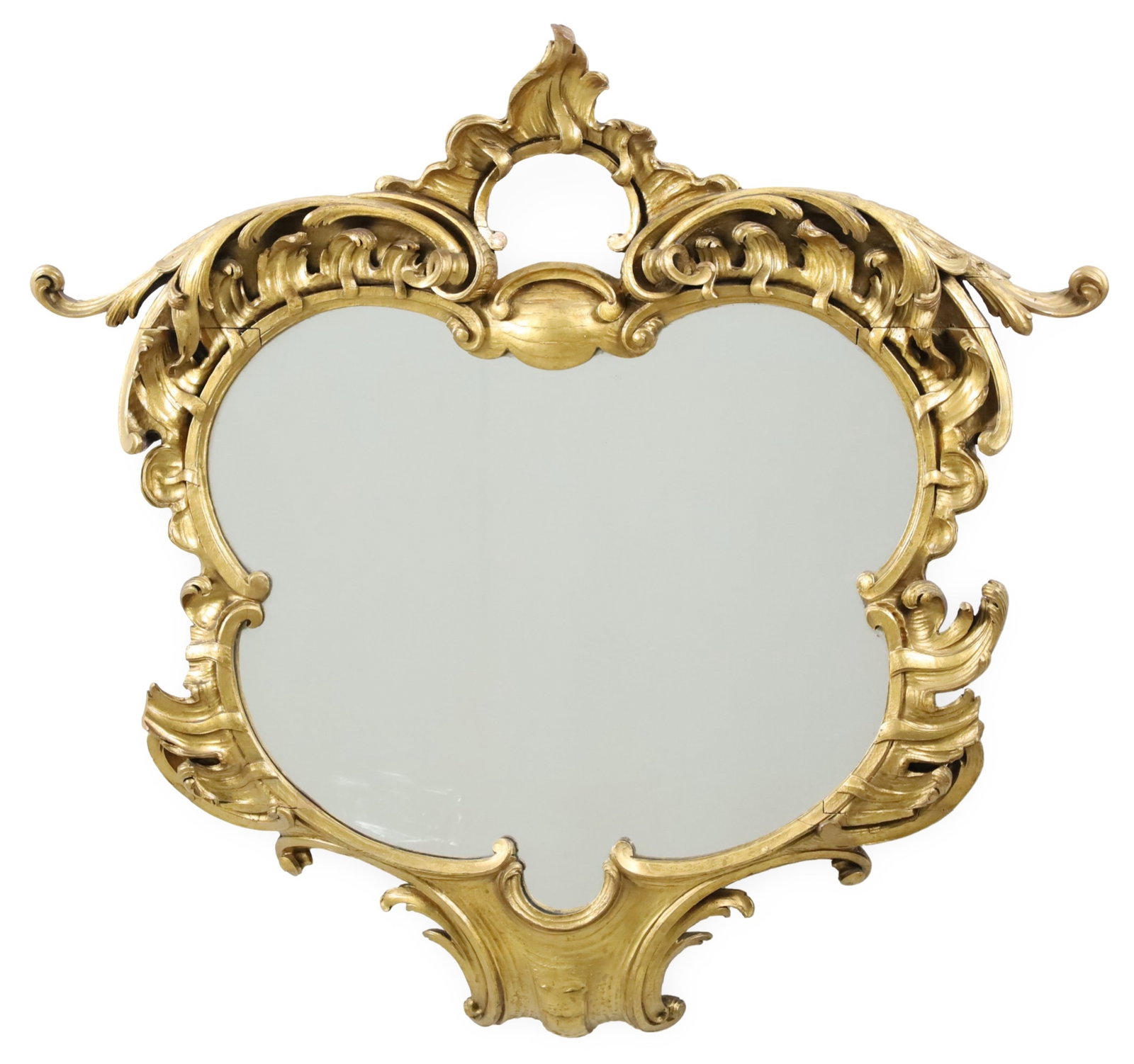 ENGLISH GILTWOOD MIRROR, 19TH C.: English giltwood mirror, having flame and scroll crest rail with quatrefoil shaped looking glass, 19th century; 34"H 35"W