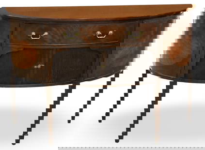 ENGLISH MAHOGANY BOWFRONT SIDEBOARD: English mahogany bowfront sideboard, having frieze drawer above tambor door cabinet and two flanking cabinets, raised on tapered legs with spade feet, early 20th century; 35"H 54"W 24"D