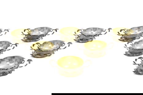 SET OF 6 TIFFANY & CO. STERLING BOUILLON CUPS: Set of six sterling silver bouillon cups with open work filigree and gold vermeil liners, stamped Tiffany & Co. Makers Sterling along foot, along with 10 associated sterling saucers, 29 troy ounce wei