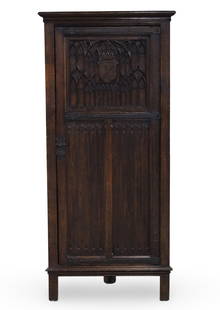 GOTHIC REVIVAL ENGLISH OAK CORNER CABINET: Gothic Revival English oak corner cabinet, having wrought iron hinge and hardware, late 19th century; 71"H 30"W 14"D