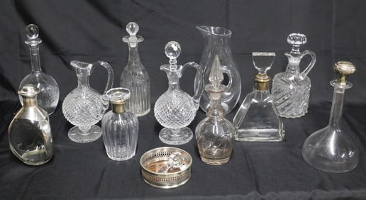 12 CUT CRYSTAL AND GLASS DECANTERS INCL. STERLING