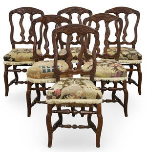 6 PETITE FRENCH PROVENCAL WALNUT SIDE CHAIRS: Set of six petite French provencal Louis XV style walnut side chairs, square peg construction, with acanthus leaf and floral carved backs having needlepoint upholstered seats, resting on cabriole legs