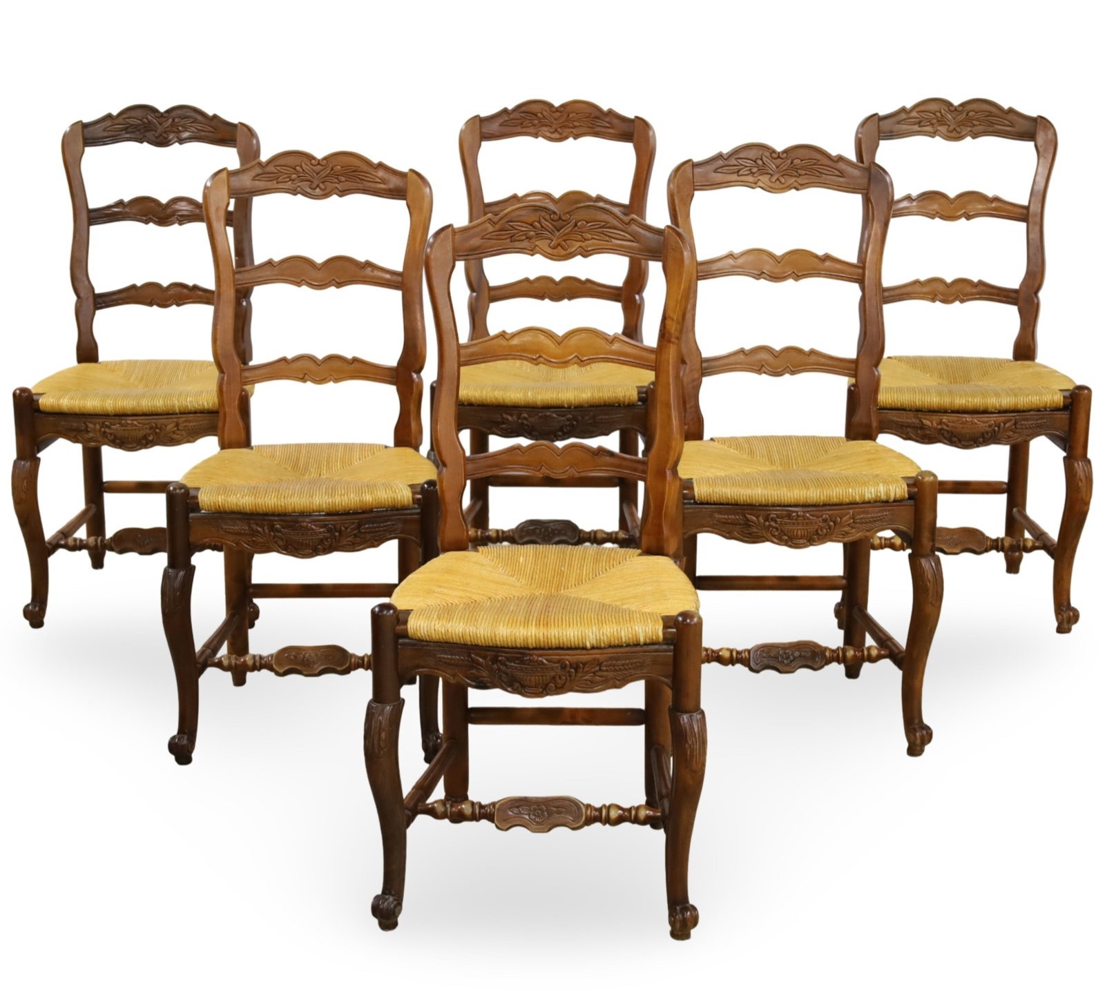 SIX PROVENCAL LOUIS XV STYLE DINING CHAIRS: Set of six Provencal Louis XV style ladder back dining chairs with floral carved crest rails and rush seats, early 20th century; 38.5"H 18"W 15"D 19" seat