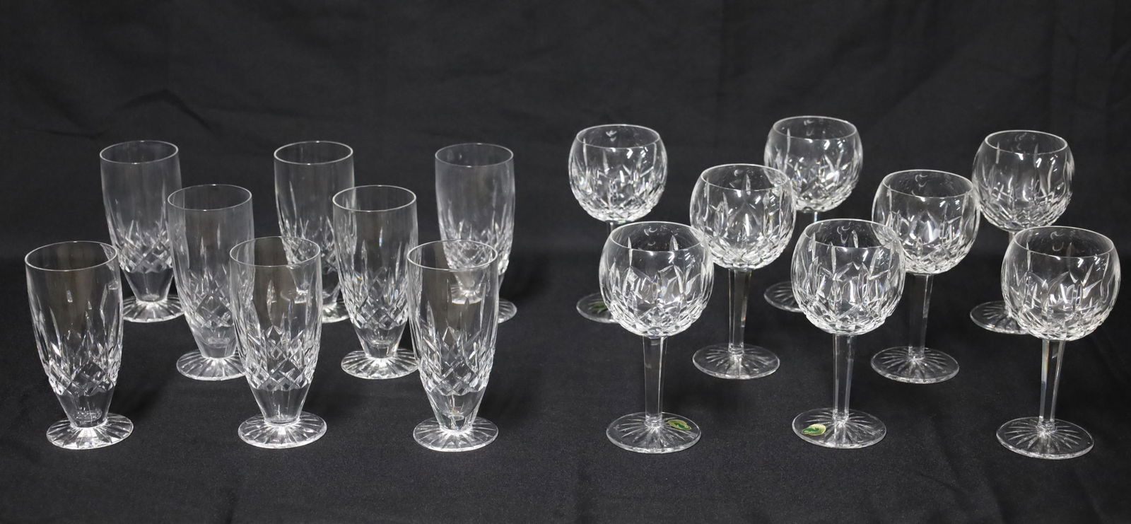 16PC WATERFORD WINE GOBLETS AND ICED TEAS, LISMORE: Sixteen piece lot of Waterford Crystal, Lismore pattern, including a service for eight of wine goblets and iced tea glasses, marked on reverse; 6.5"H and 7"H