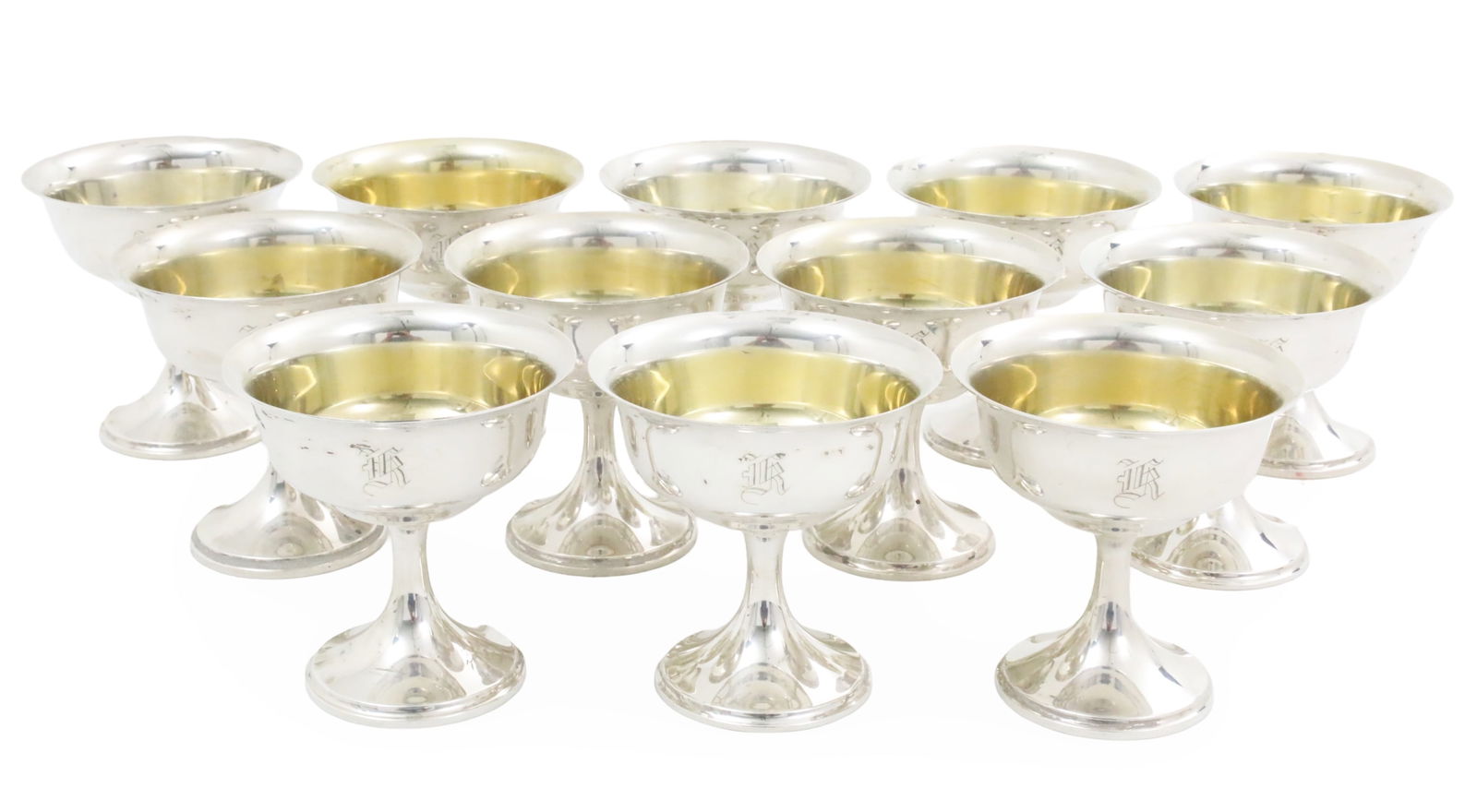 12 STERLING CHAMPAGNE COUPS, 43.8 T.O.W.: Set of twelve sterling silver champagne coups by S. Kirk and Sons, having vermeil washed bowls, stamped on reverse, 43.8 troy ounce weighable, monogrammed; each 4"H