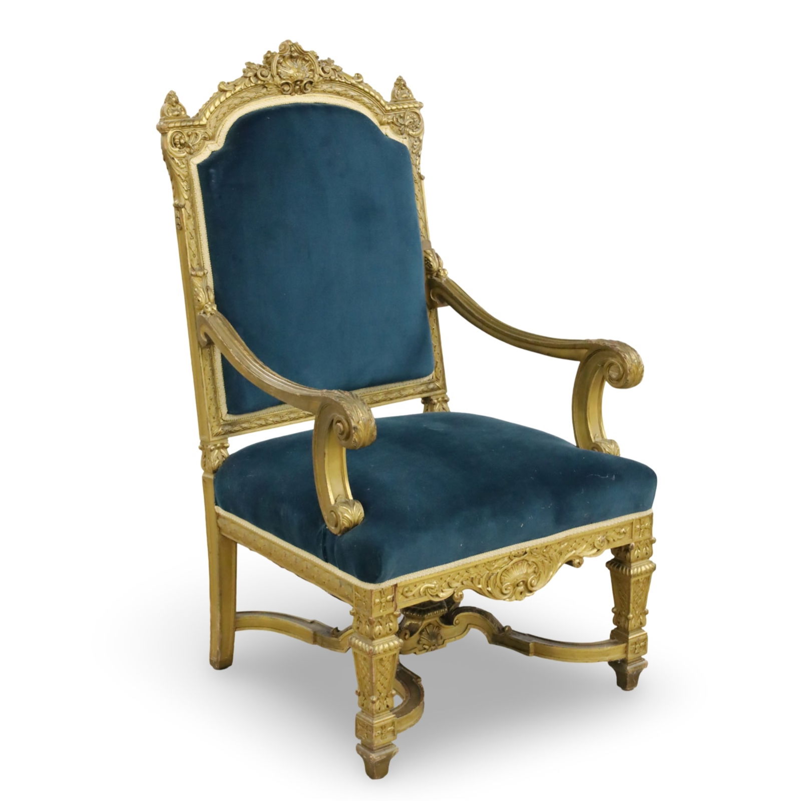 LOUIS XVI STYLE GILTWOOD ARMCHAIR, 19TH C.: Louis XVI style giltwood fauteuil armchair with carved shell crest rail and apron, having blue velvet upholstery, 19th century; 49"H 27"W 25"D