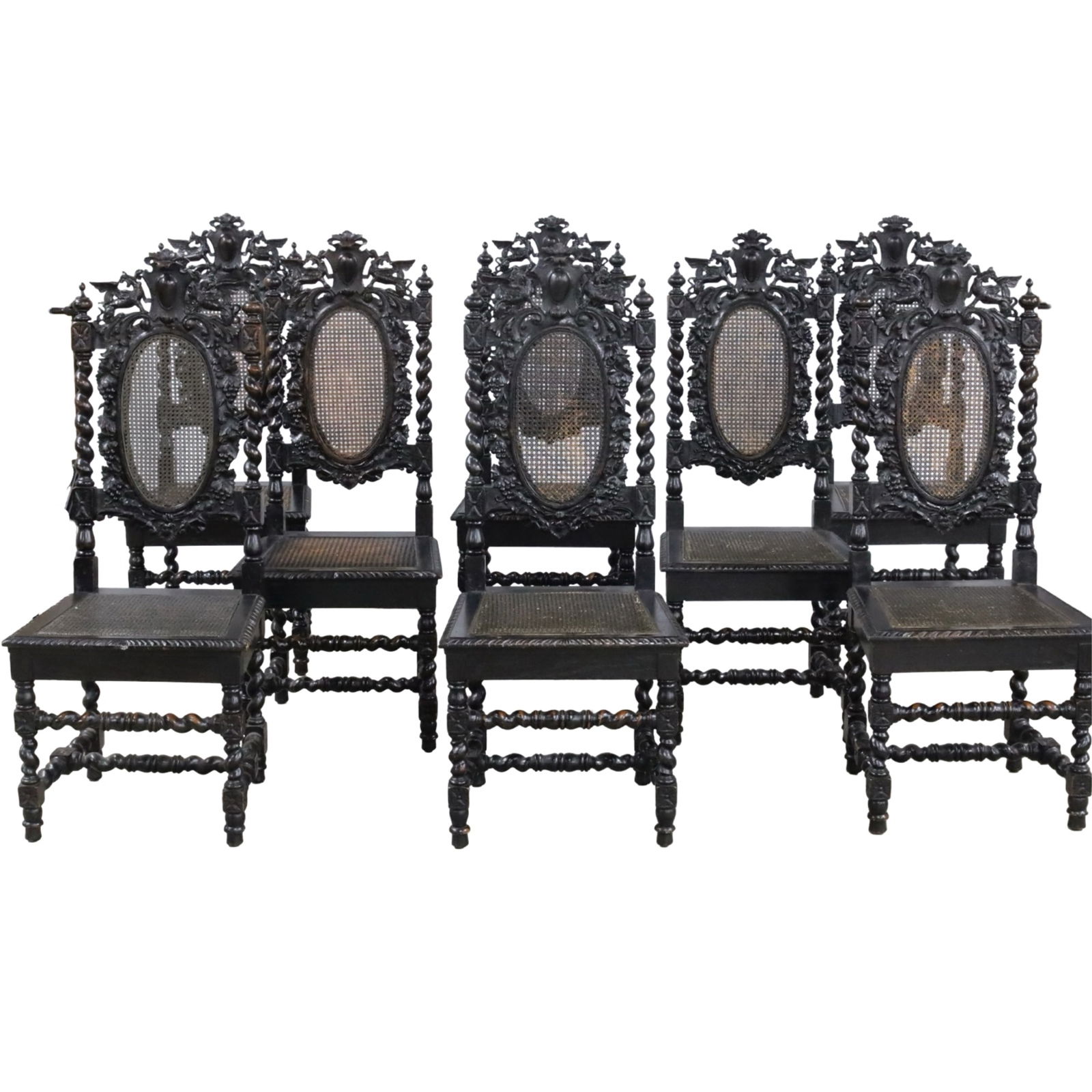 8 JACOBEAN STYLE BARLEY TWIST DINING CHAIRS: Set of eight Jacobean style dining chairs, the crest rails carved with cartouche flanked by griffons, rosette and barely twist stiles supporting a caned back with foliate surround, gadrooned seat rail