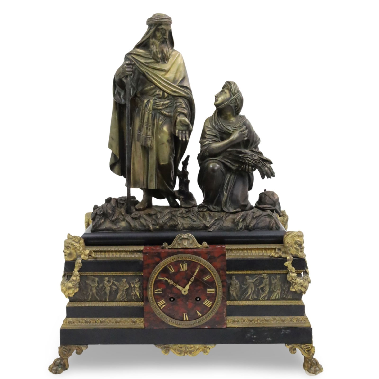 NAPOLEAN III BRONZE AND MARBLE MANTEL CLOCK: Napolean III bronze and marble mantle clock, mounted with bronze sculpture of two Orientalist figures, having a rouge marble dial set with black marble case with gilt bronze mask surmounts, classical
