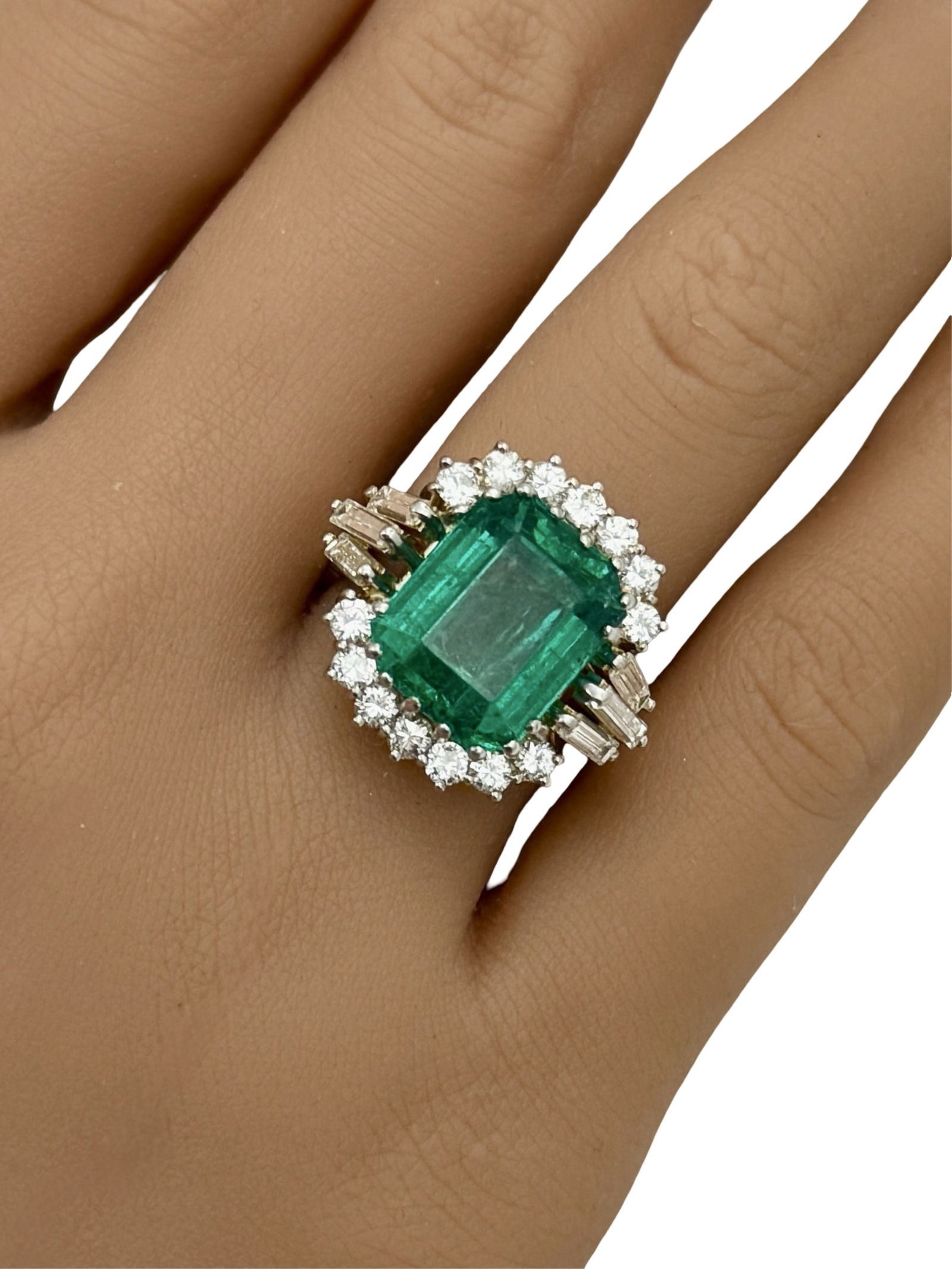 PLATINUM 7.79CT EMERALD RING, GIA: Platinum ring with 7.79ct step cut ocatagonal GIA certified emerald surrounded by 1.2cts of VS1-VS2 quality diamonds. gross weight 112grams. size 5.5 .Please see all photos, appraisal, and GIA #