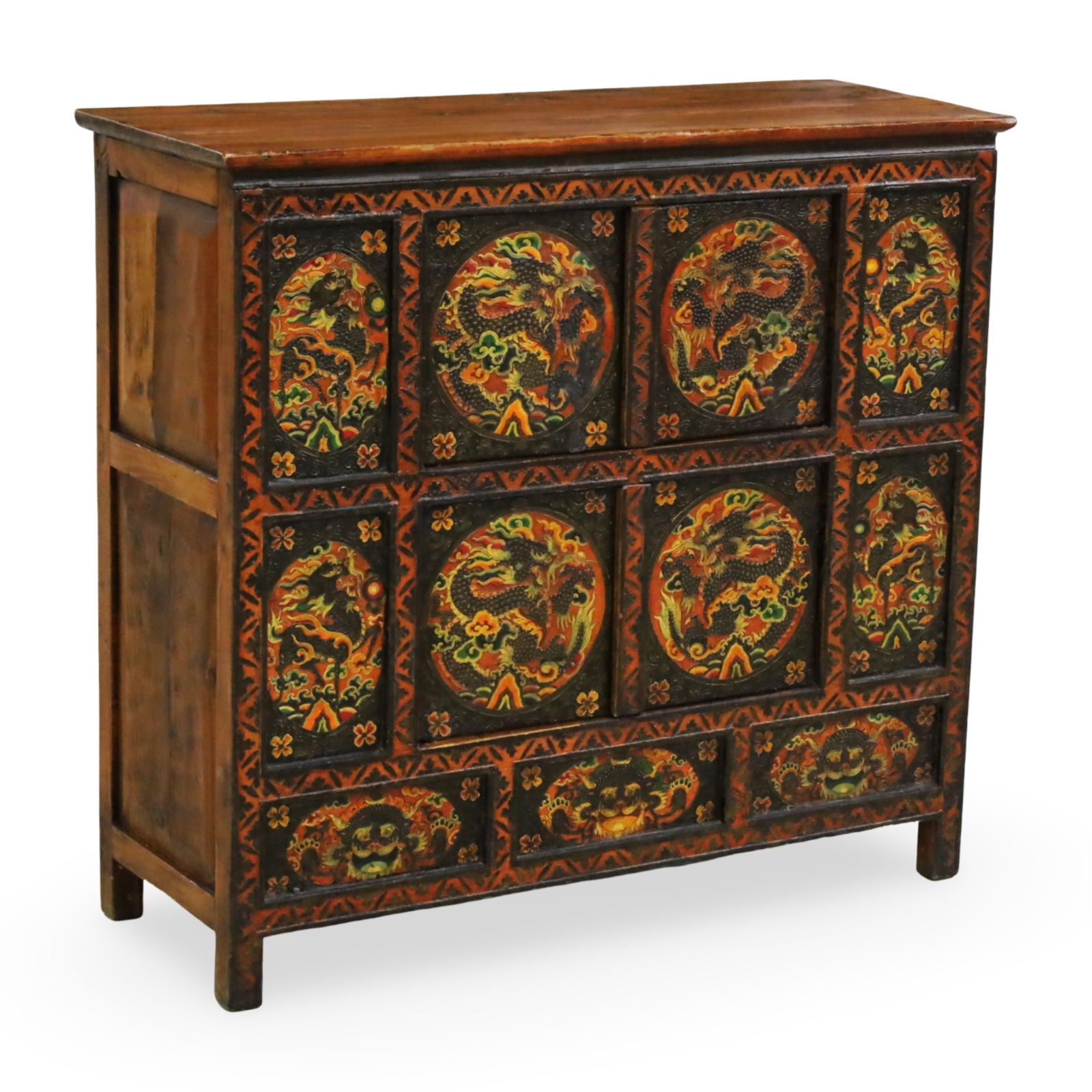 TIBETAN POLYCHROME CABINET, 19TH C.: Tibetan polychrome paneled camphor wood cabinet with vibrant hand painted dragon decoration, late 19th century; 41"H 45"W 16.5"D
