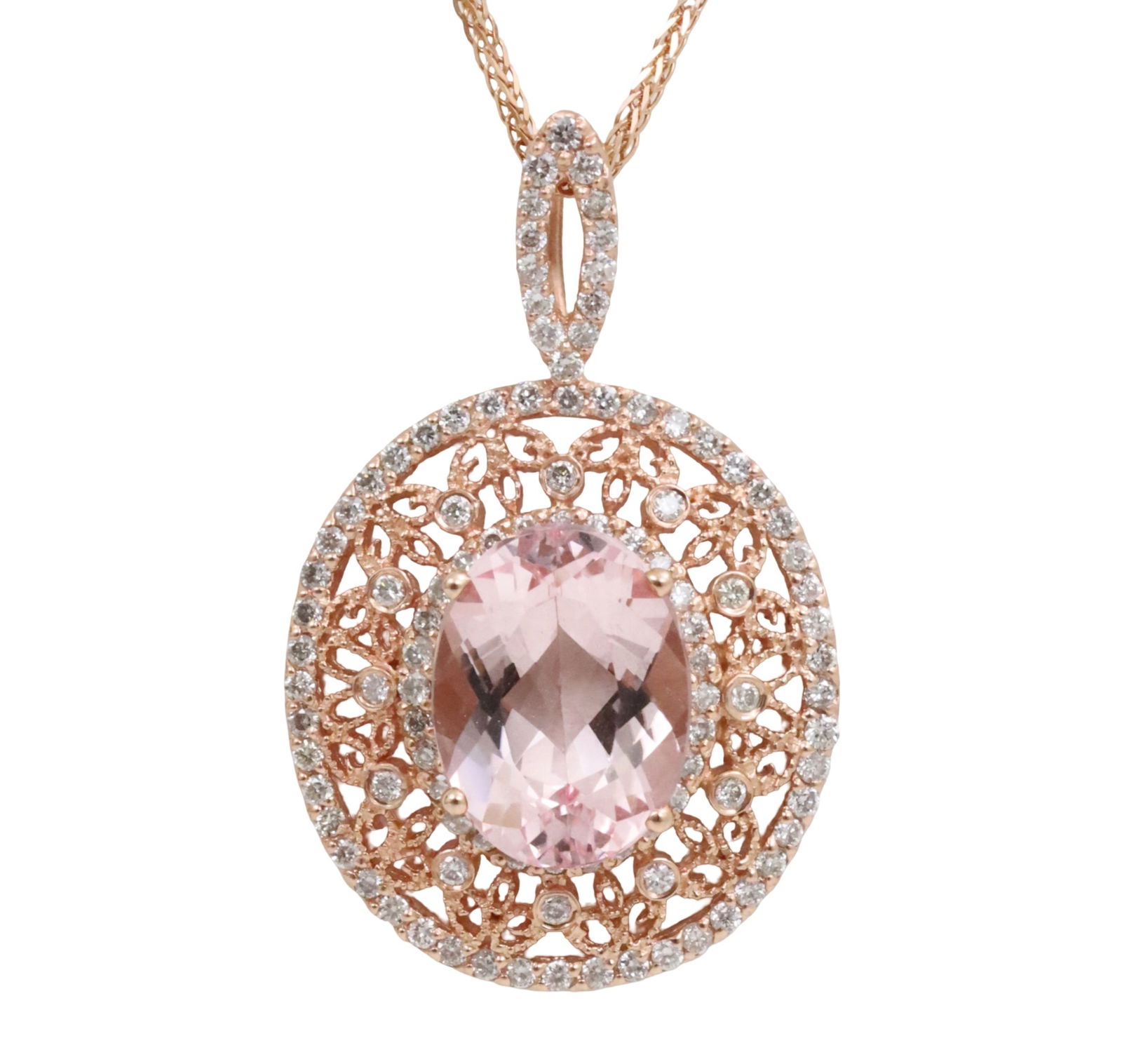 14K ROSE GOLD MORGANITE AND DIAMOND PENDANT: 14k rose gold morganite and diamond pendant having 3.84ct center stone measuring 12.21 x 9.81mm with .60cts of diamonds surrounding. total weight is 6 grams. Please see all photos and appraisal. note: