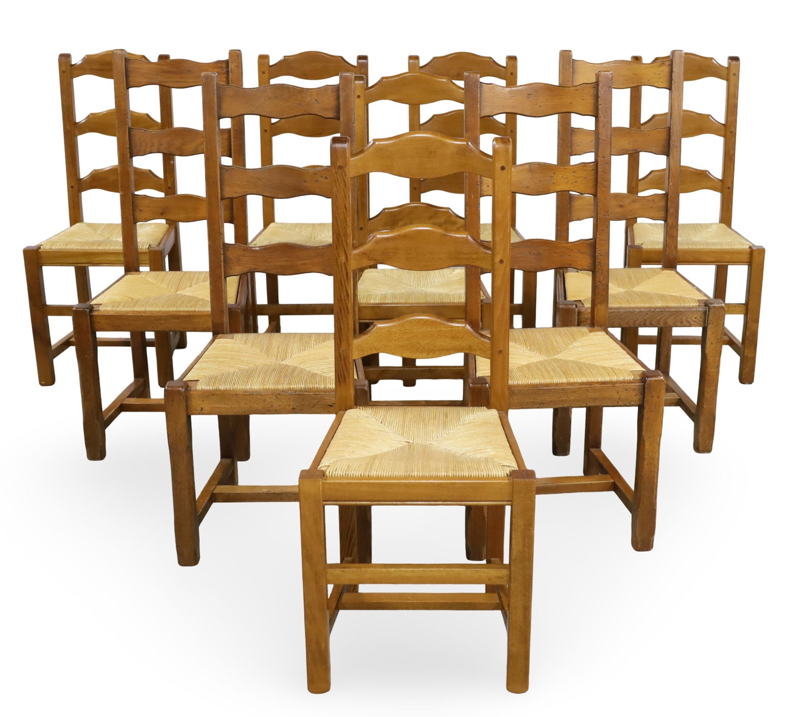10 FRENCH OAK LADDER BACK CHAIRS: Harlequin set of ten provincial French oak ladder back chairs having rush seats, including six matching chairs along with four additional matching chairs; 42"H 17"W 15"D 18.5" seat