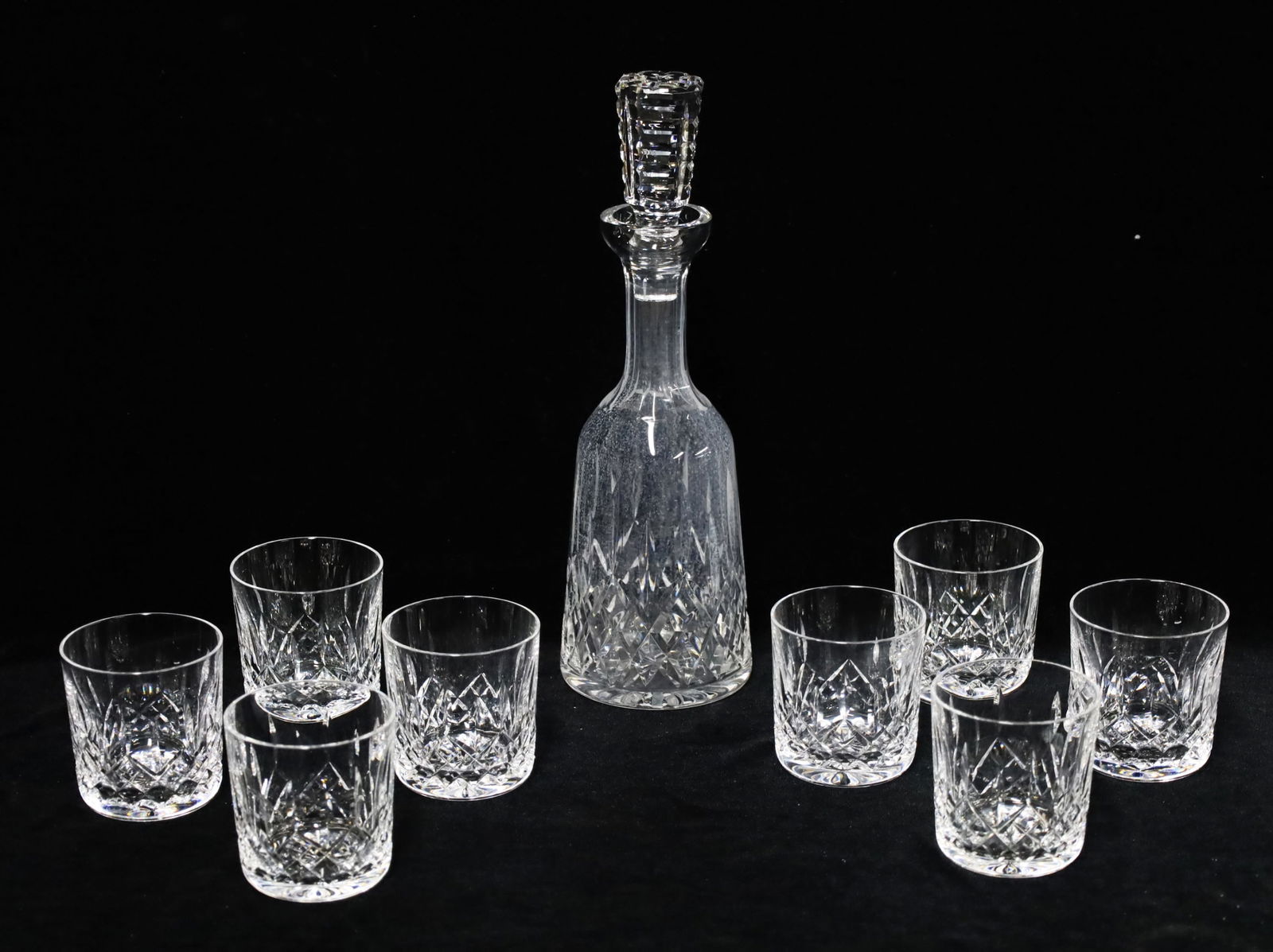 9PC WATERFORD CRYSTAL, LISMORE PATTERN: Nine piece lot of Waterford crystal, Lismore pattern, including a set of eight old fashion glasses along with a large decanter; glasses 3.5"H decanter 13.5"H; Condition: decanter shows residue and nee