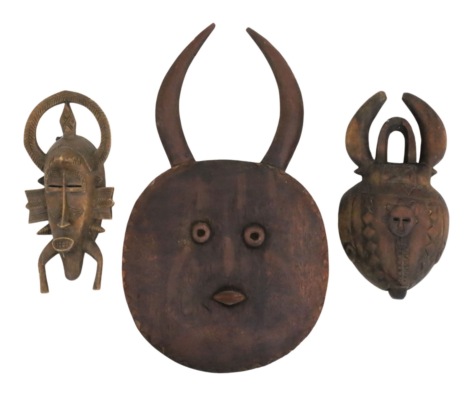 THREE WEST AFRICAN TRIBAL MASKS (1 of 5)