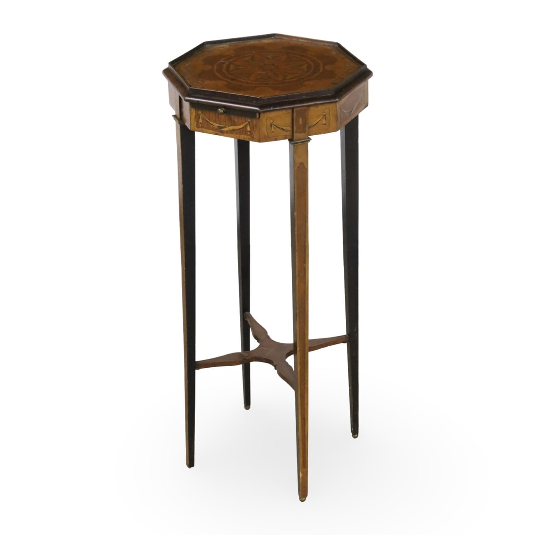 GEORGIAN INLAID MAHOGANY KETTLE STAND, 19TH C.: Georgian inlaid mahogany kettle stand, the octagonal top with stainwood floral starburst marquetry, the frieze hosting a single candle slide, raised on tapered legs, 19th century; 31"H 13.5" Diameter