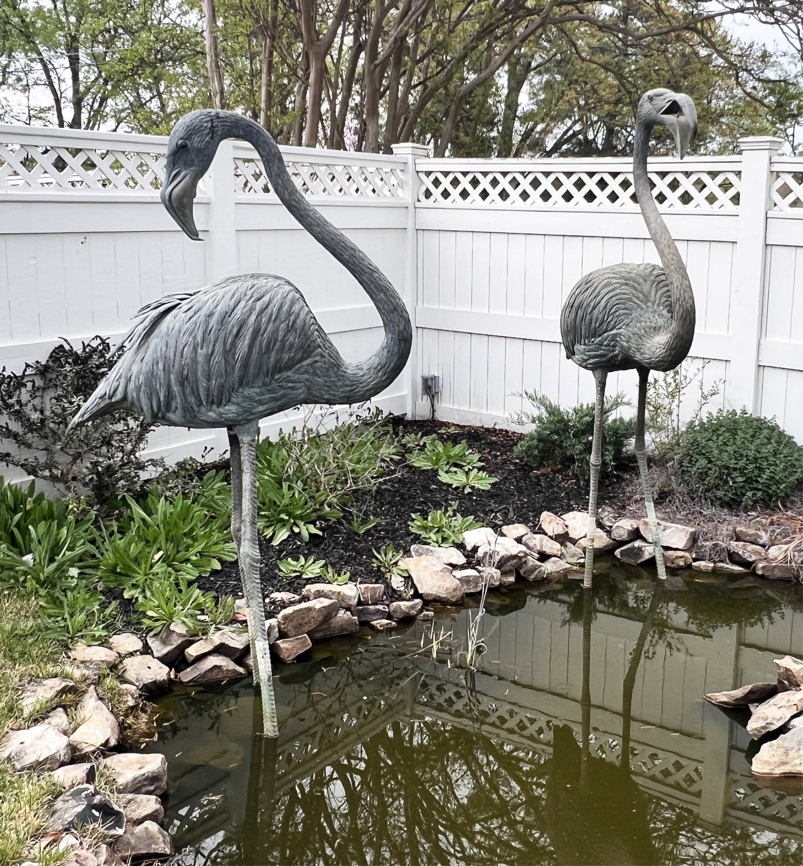 PR BRONZE GARDEN SCULPTURE FLAMINGOS: Colossal pair of bronze garden sculpture flamingos, 20th century; tallest 90"H approx. 30" bases; Condition: repair to legs of one flamingo