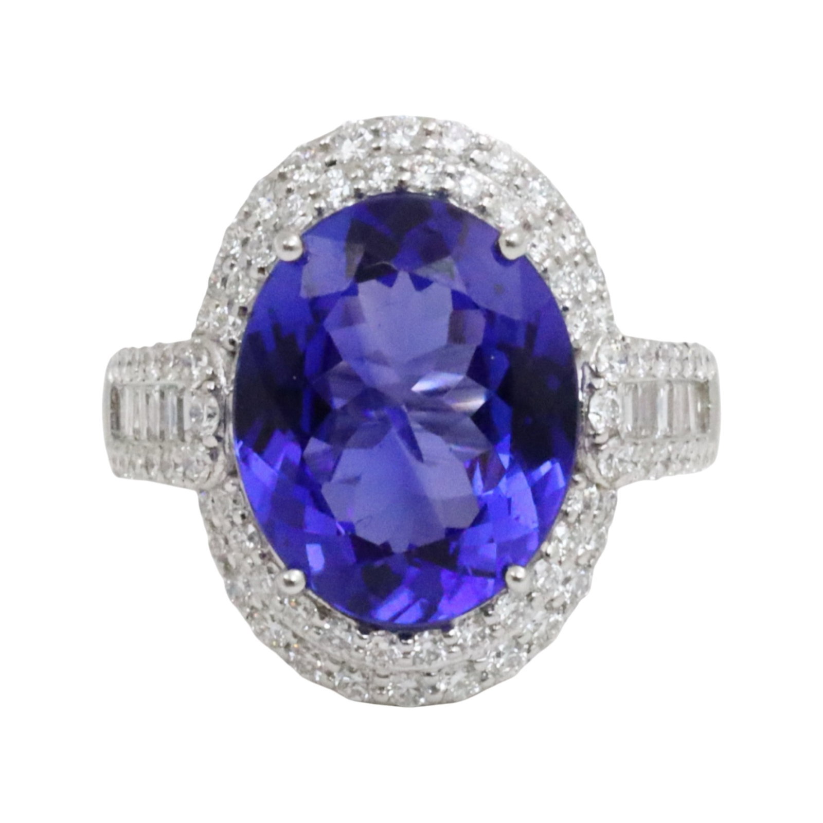 14K OVAL TANZANITE AND DIAMOND RING: 14K tanzanite and diamond ring iwht 7.51ct center stone and 1.40cts surrounding round and banquette diamonds. size 7.25. total weight of 6.2grams. Please see all photos and appraisal. Note: this lot m