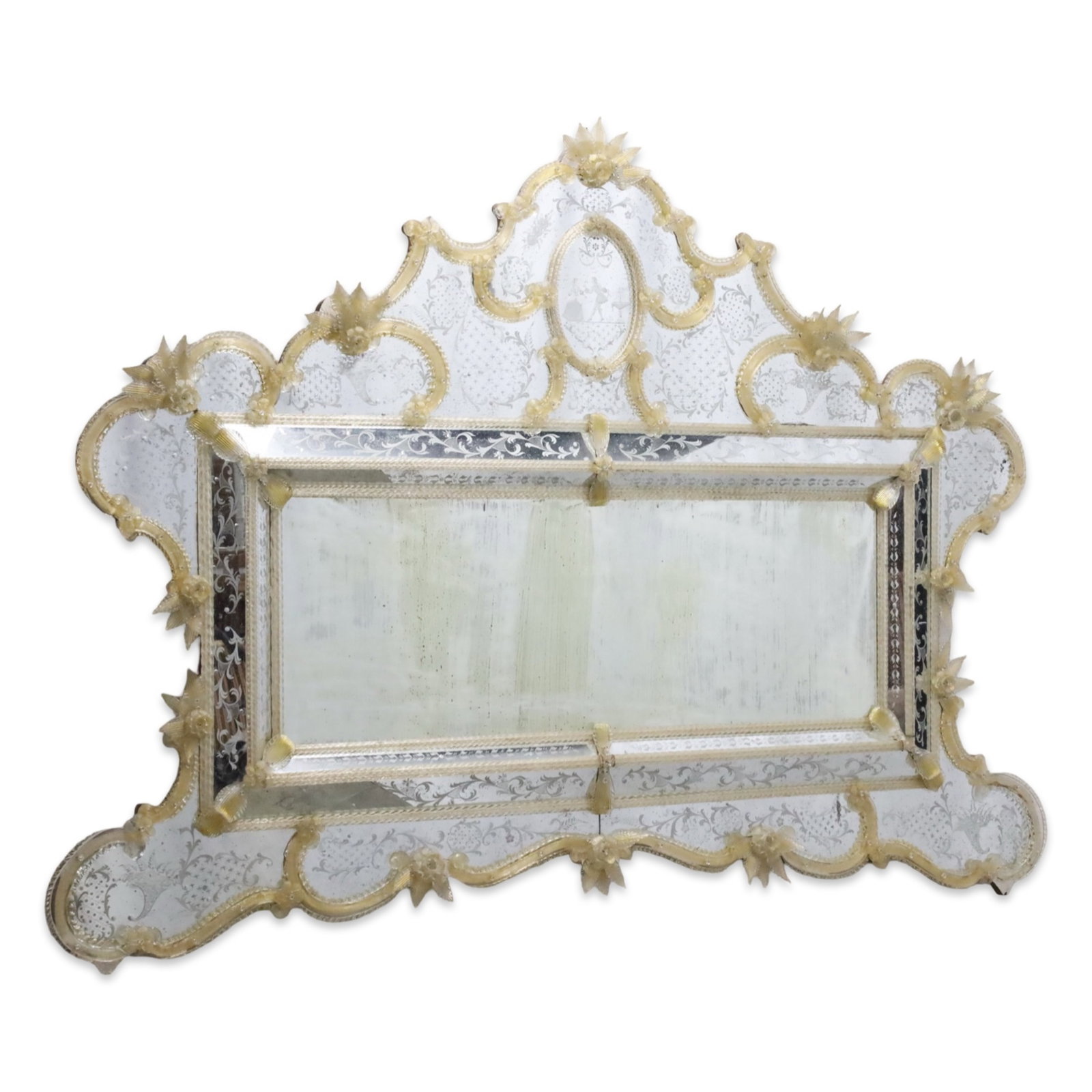 PALACIAL VENETIAN MURANO GLASS MIRROR: Palacial Venetian landscape mirror, having etched glass panels, gold infused braided Murano glass moldings, and applied floral accents; 55"H 79"W; Condition: oxidation to center mirror, various losses