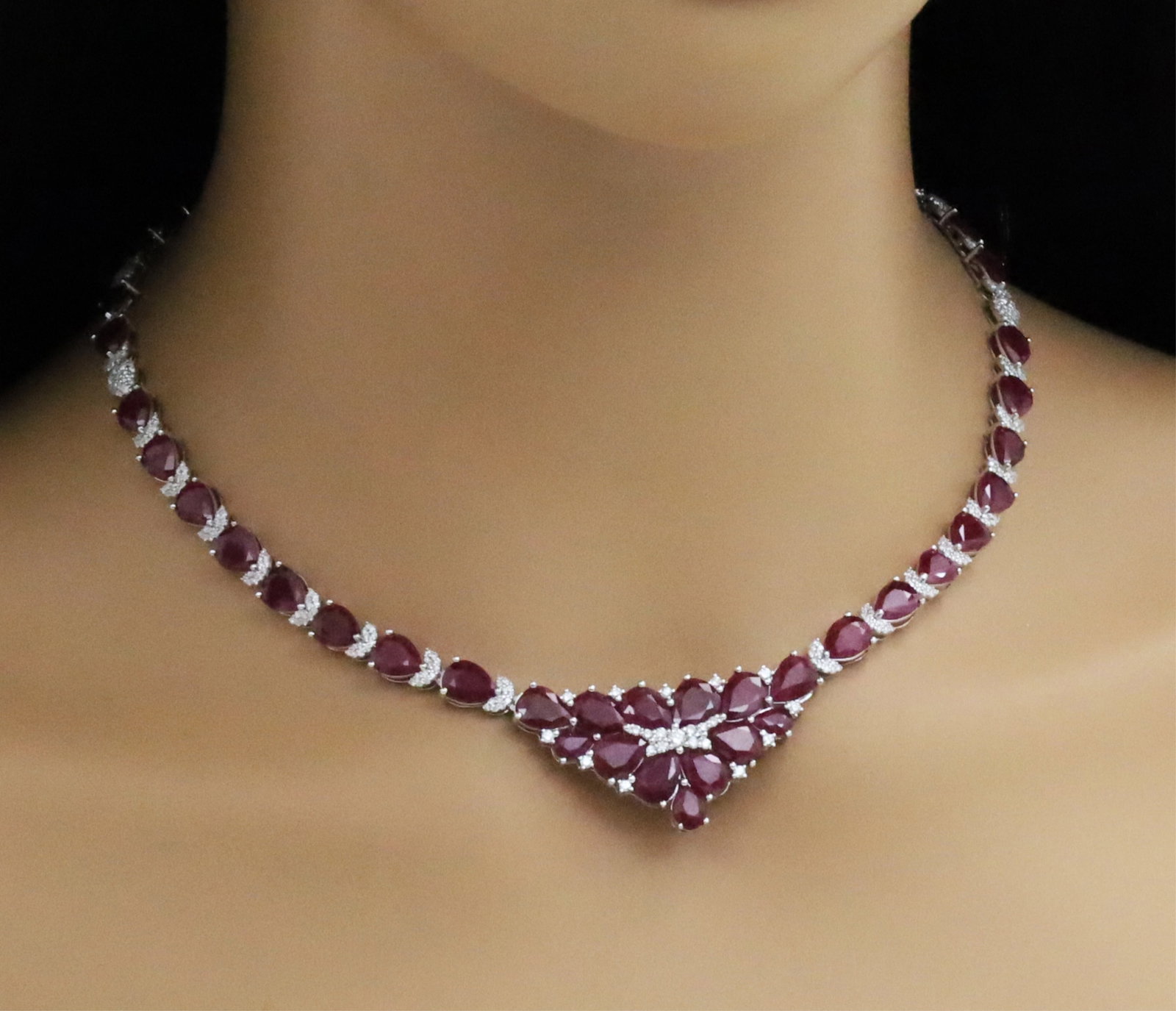 GIA BURMESE RUBY AND DIAMOND NECKLACE: Platinum necklace mounted with 46 pear shaped rubies weighing approx 47.92cts and having 2.94cts of diamonds. total weight of 40.8 grams. 17.5inches long. Please see all photos,appraisal, and