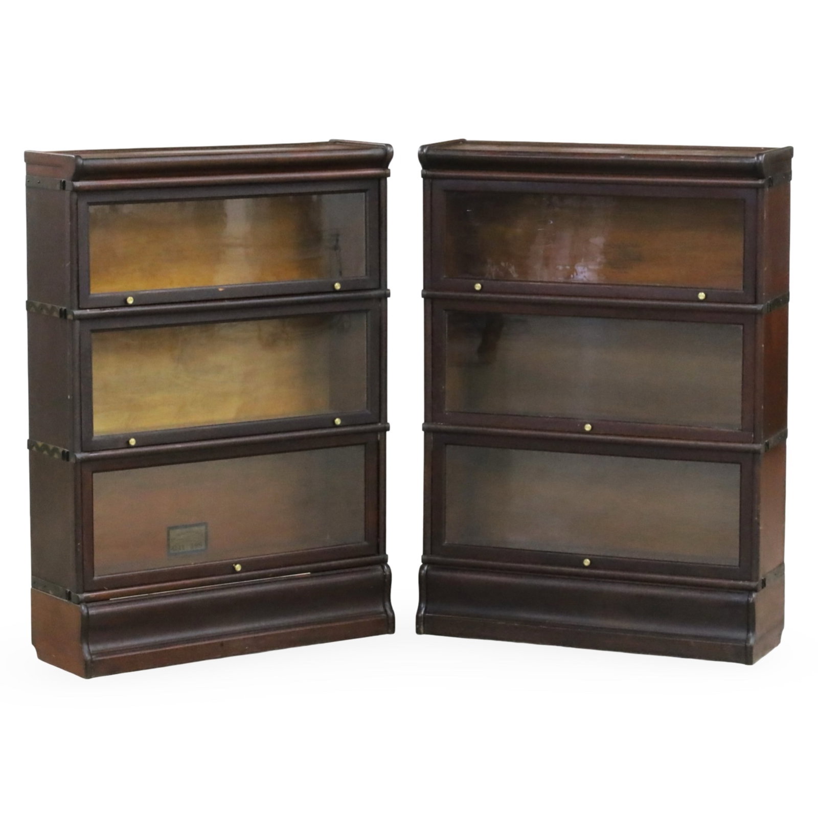PR GLOBE WERNICKE BARRISTER BOOKCAKSES: Pair of Globe Wernicke barrister bookcases, each having three cabinets with recessing lift front glass panel doors, late 19th/early 20th century; 48"H 34"W 11"D