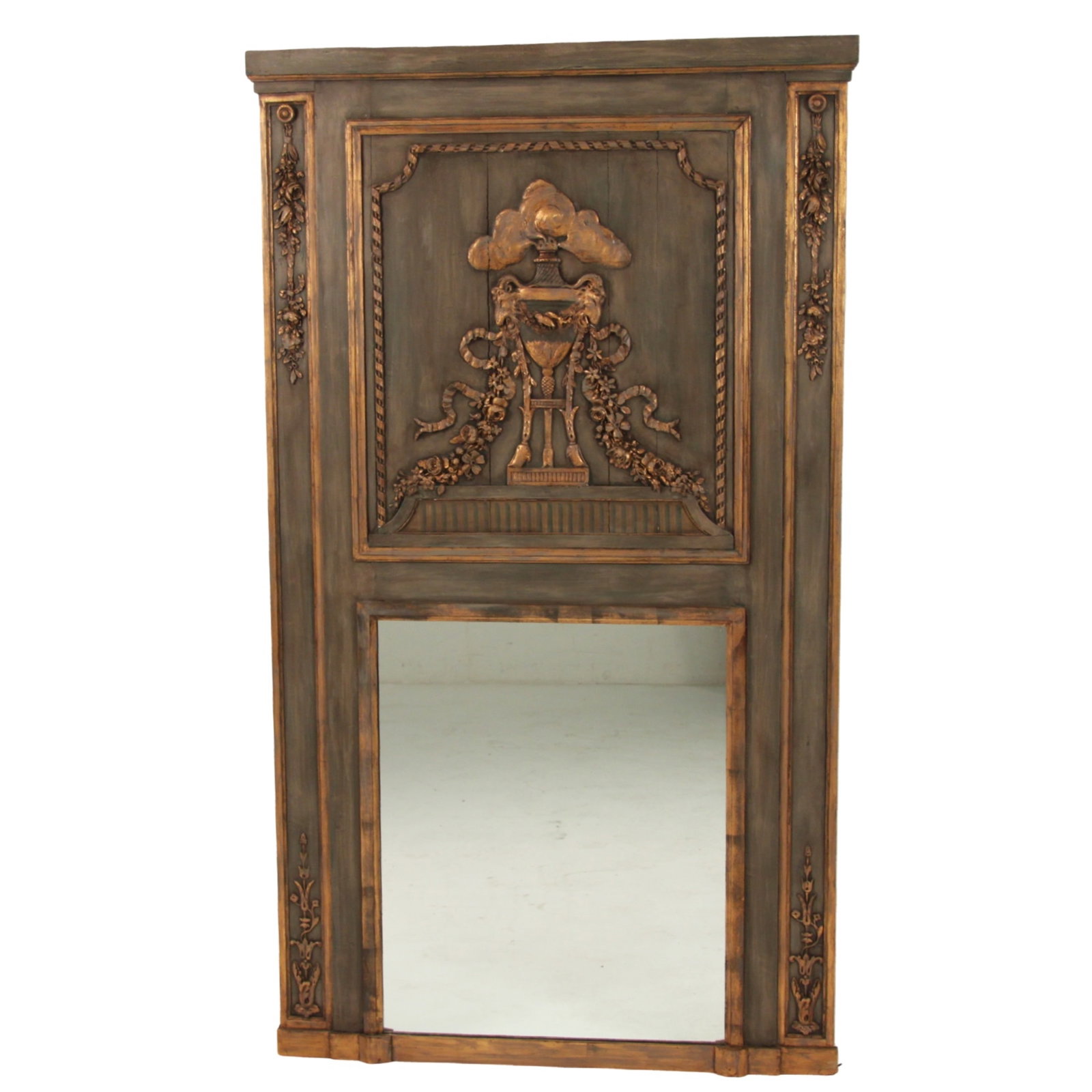 FRENCH POLYCHROME TRUMEAU MIRROR, 19TH C.: French polychrome and gold gilt carved trumeau mirror having raised classical center urn design surrounded by swag and flower, 19th century; 74"H 42.5"W; Condition: areas of vertical line separations 