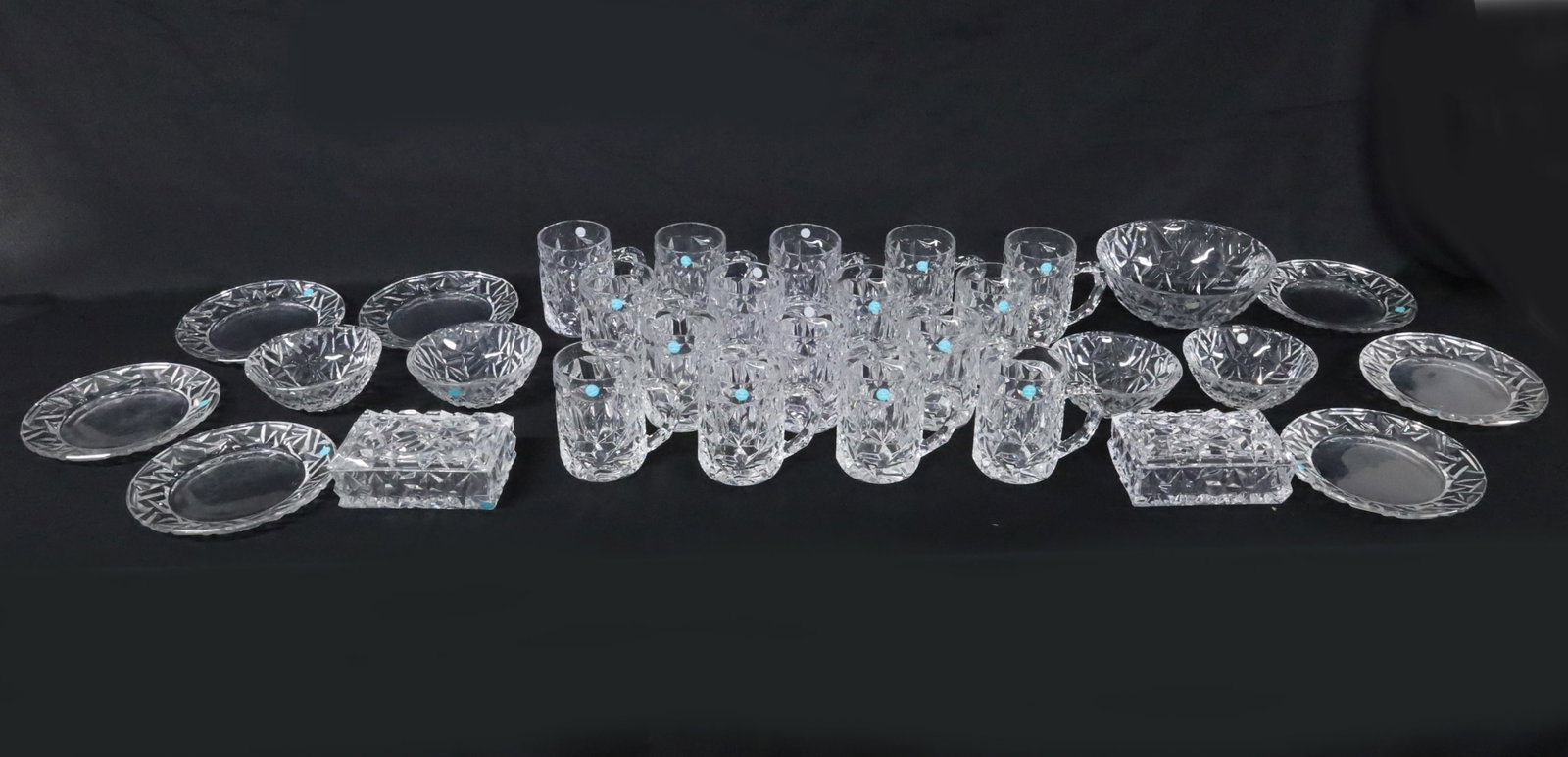 29PC TIFFANY & CO CRYSTAL: Twenty nine Tiffany & Co crystal service, including sixteen mugs, six luncheon plates, large bowl, four smaller bowls, and pair of covered candy dishes; mugs 5"H plates 8" largest bowl 4"H 9"Dia