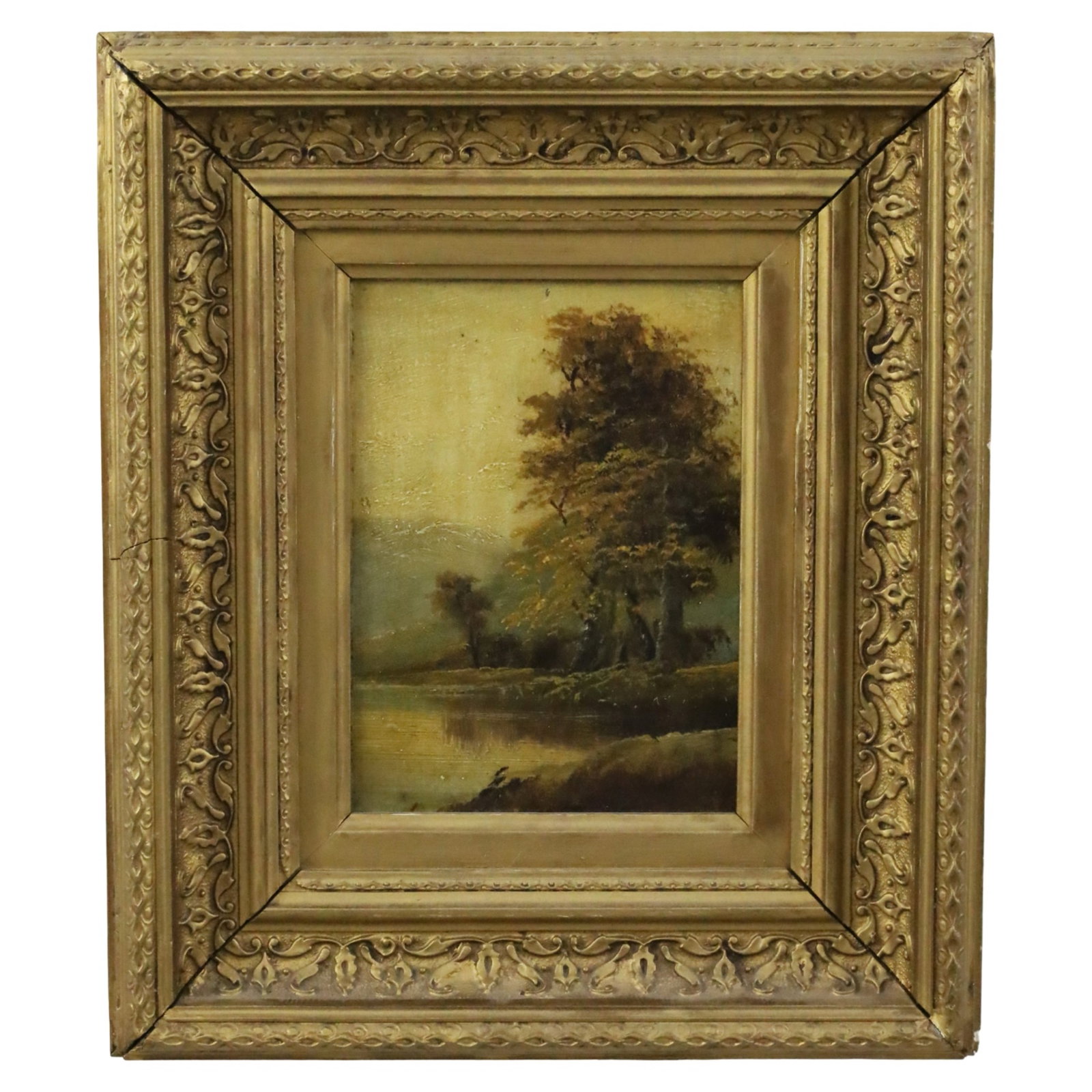 ANTIQUE OIL ON BOARD LANDSCAPE PAINTING: Oil on board landscape painting depicting a golden oak beside a river, unsigned, mounted in ornate giltwood frame, late 19th/early 20th century; 15"H 13"W overall