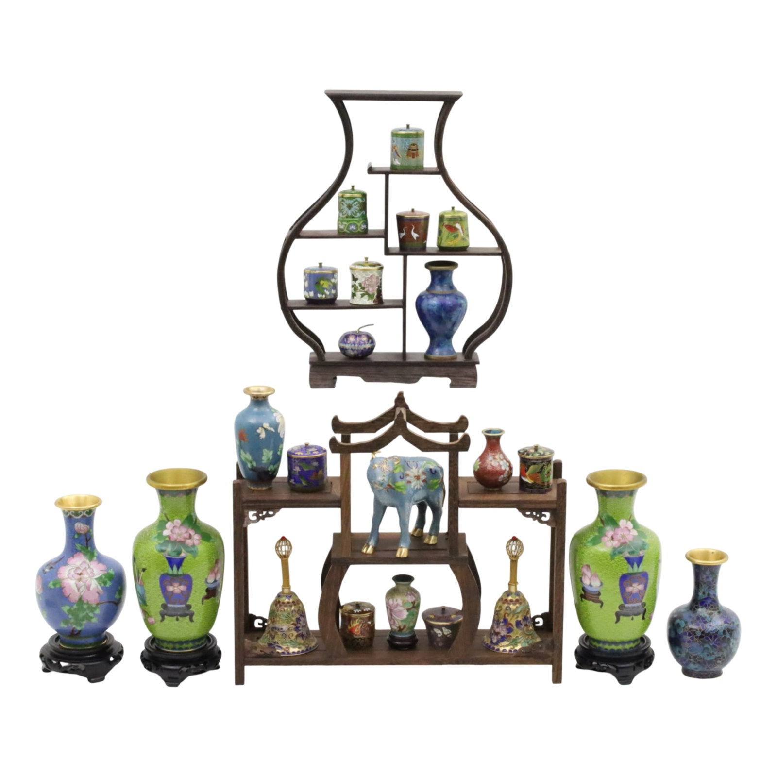 24PC COLLECTION OF CHINESE CLOISONNE: Twenty four piece collection of Chinese cloisonne enamel items, presented in two shaped teakwood etageres, various lidded boxes, vases, pair of bells, and ox figurine, early to mid 20th century; large