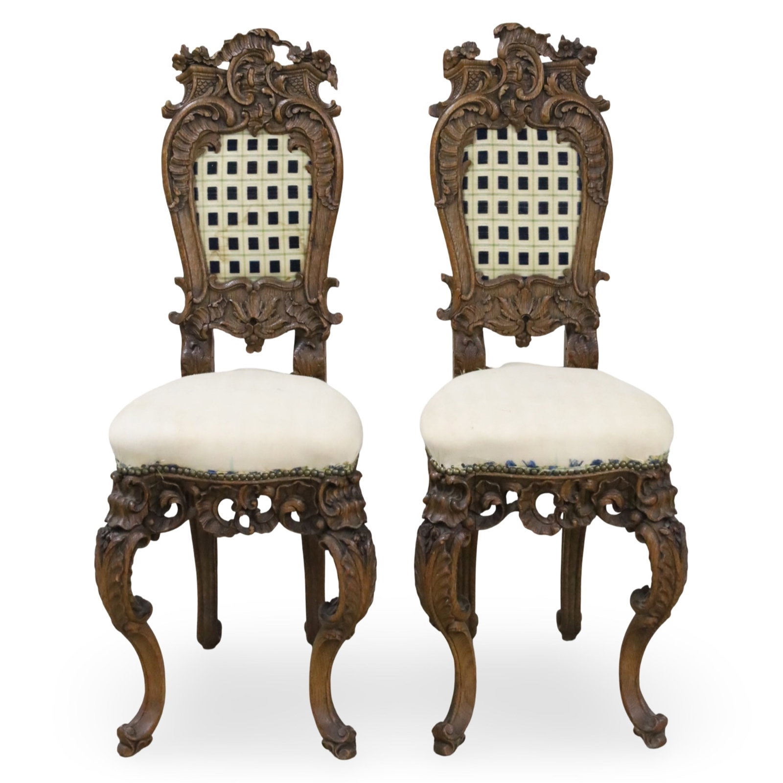 PR FRENCH WALNUT PETITE SIDE CHAIRS: Pair of French walnut petite side chairs featuring intricately carved crest rails, aprons, and cabriole legs, 19th century; each 39.5"H 14"W 13"D 18" seat; Condition: seat upholstery has been removed