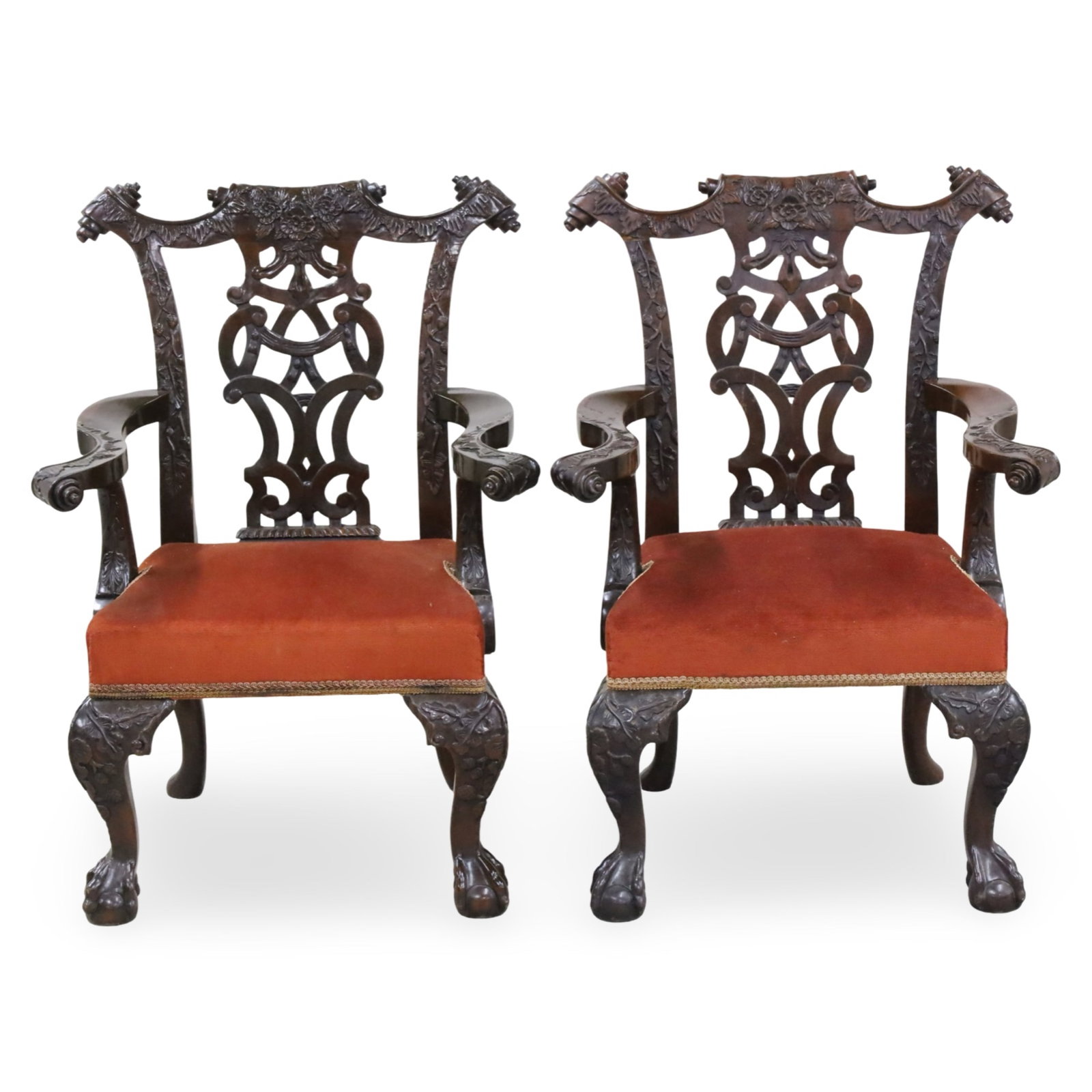PR SALESMAN SAMPLE IRISH CHIPPENDALE CHAIRS: Fine pair of Irish Chippendale style salesman sample mahogany armchairs, featuring elaborate carvings such as oak leaves, acorns, and scrolls, along with interlaced splats and cabriole legs ending in 