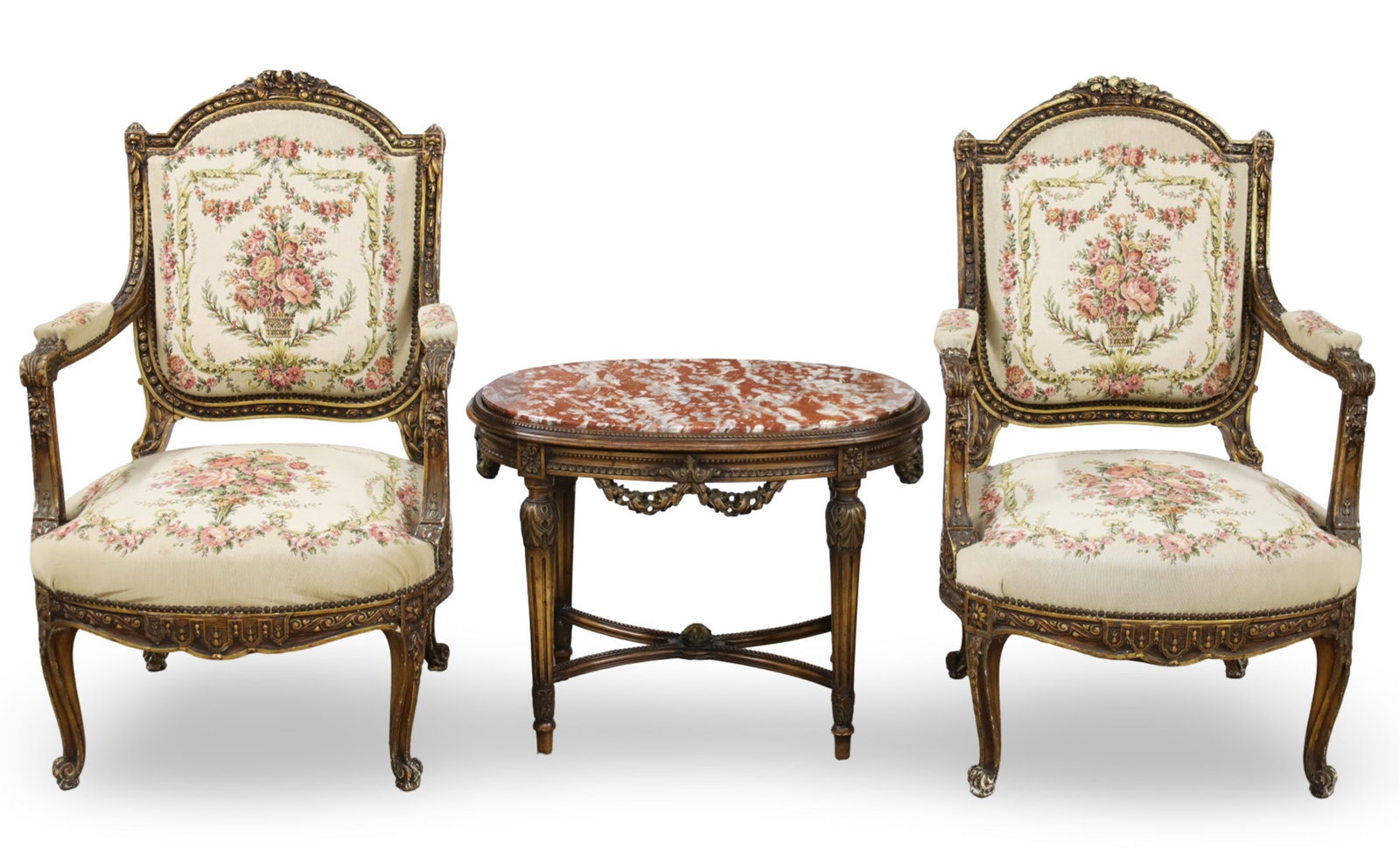 PR FRENCH ARMCHAIRS AND MARBLE TOP LOW TABLE: Three piece lot of French furnishings, including a pair of Louis XV style giltwood fauteuils or armchairs having needlepoint uphostery, along with an oval Louis XVI low or coffee table having rouge ma