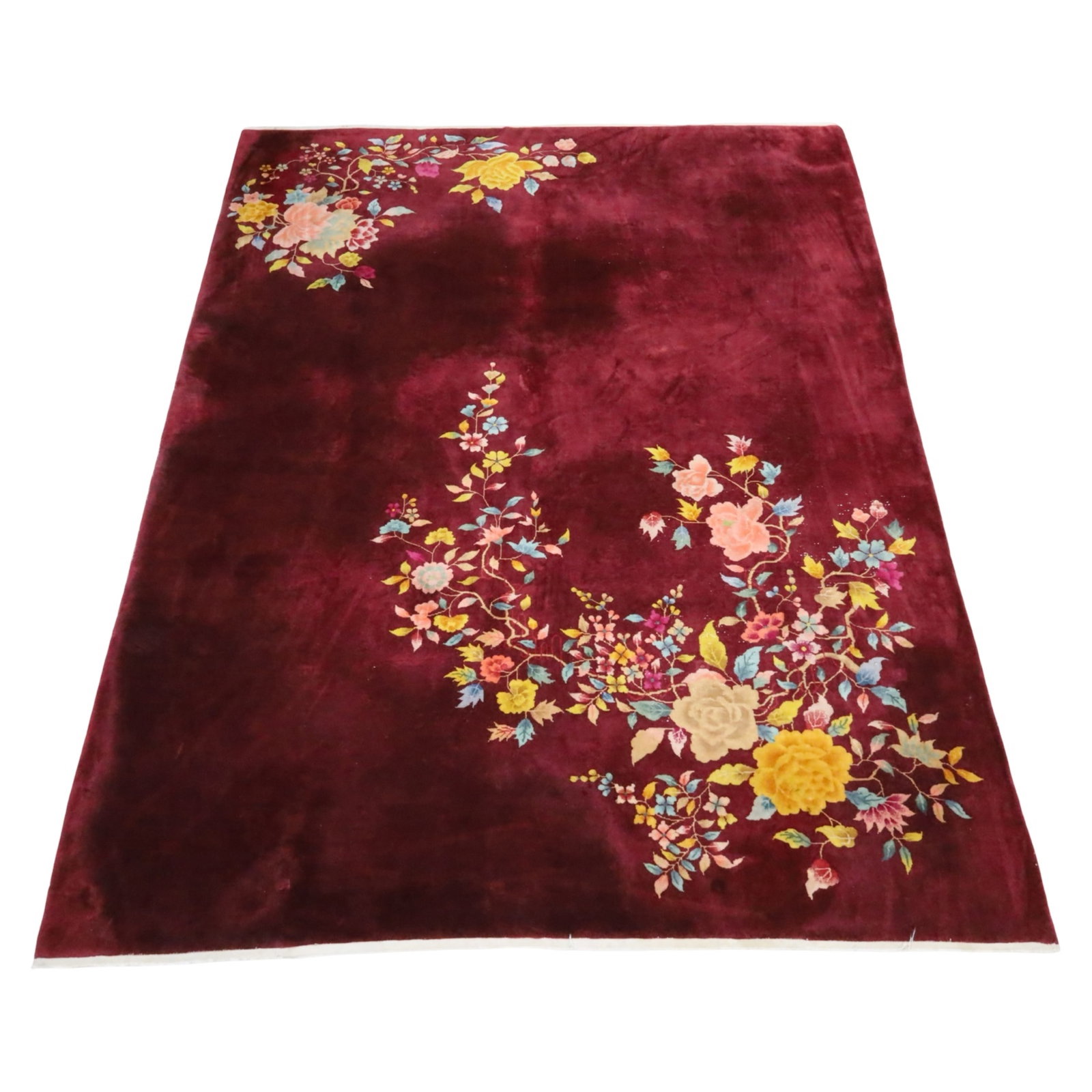 CHINESE ART DECO RUG 11'9 X 8'11: Chinese Art Deco rug with oxblood field and sprawling floral design, early 20th century; 11'9 X 8'11