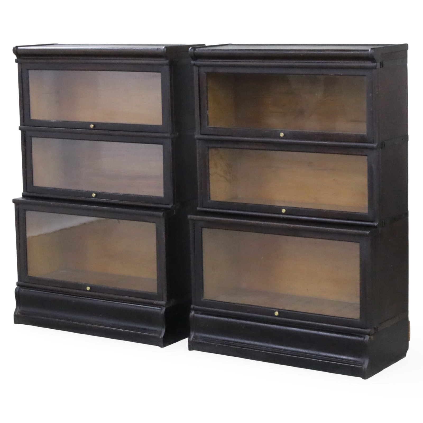 PAIR OF BARRISTER BOOKCASES: Pair of barrister bookcases having three graduating cabinets with recessing lift front glass panel doors, along with another cabinet section, late 19th/early 20th century; 51"H 34"W 12"D