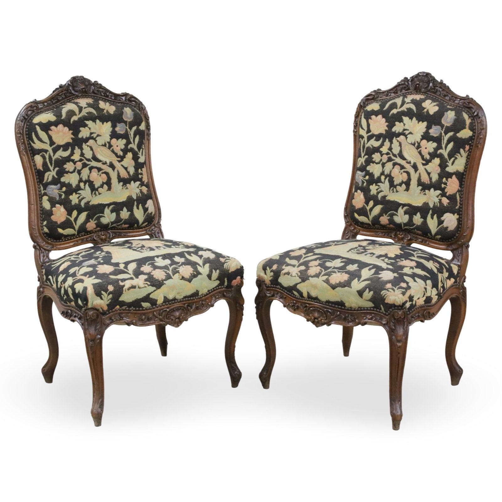 PR LOUIS XV STYLE NEEDLEPOINT SIDE CHAIRS, 19TH C.: Pair of Louis XV style walnut side chairs, having well carved crest rail with shell and foliate design, needlepoint upholstery with bird and courting scene reserves, 19th century; each 41.5"H 23"W 19"