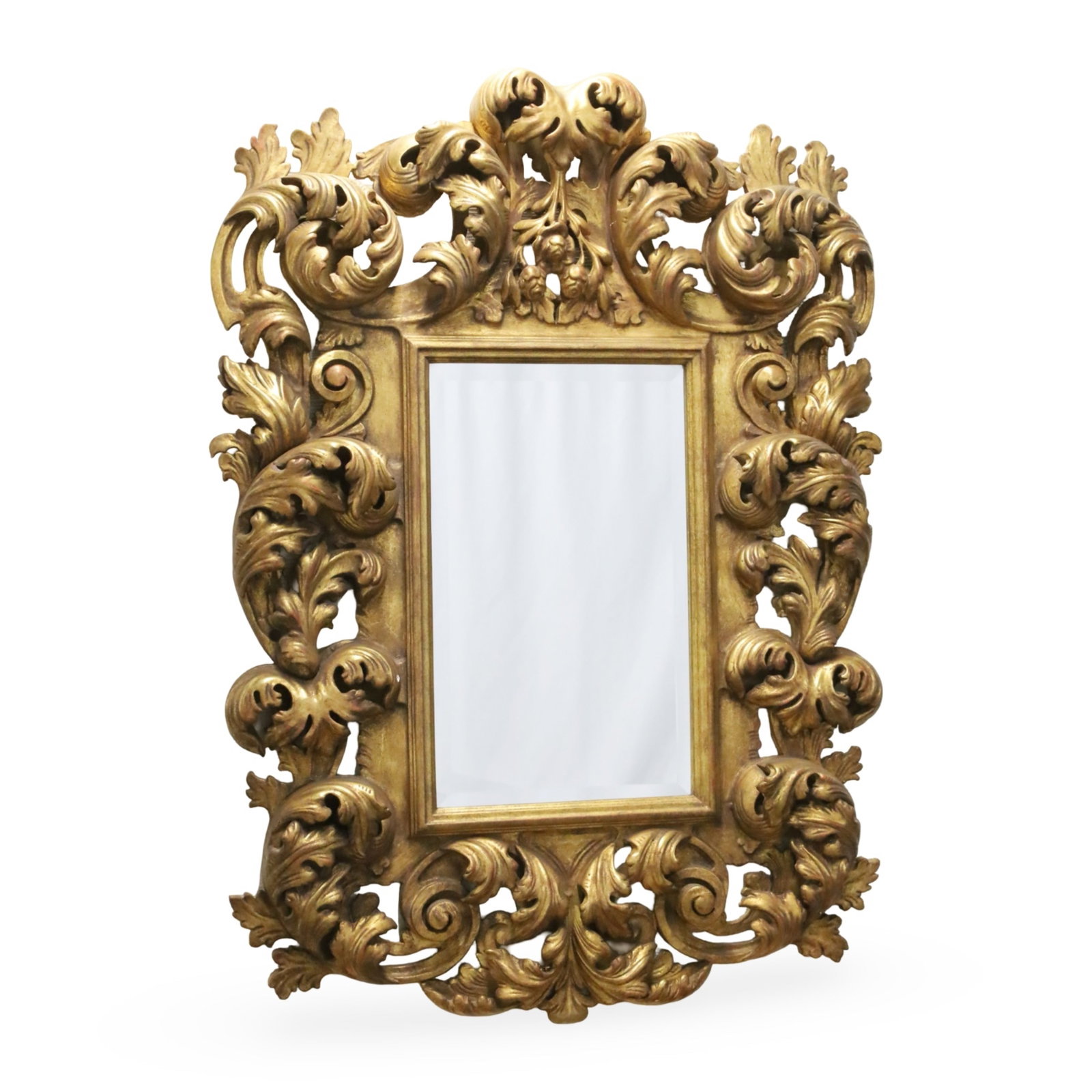 BAROQUE STYLE BEVEL GLASS MIRROR: Barqoue style bevel glass miror with heavy acanthus leaf and scrollwork decoration; 54"H 38"W 4.5"D