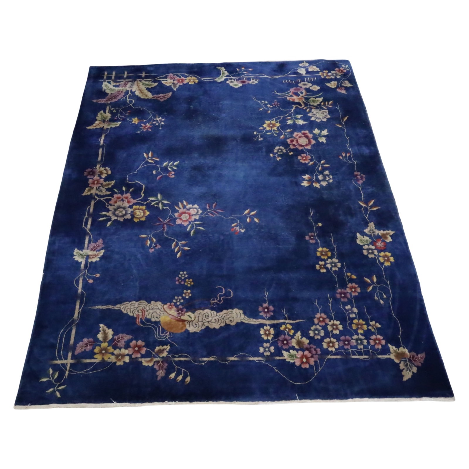 CHINESE ART DECO RUG 9'7 X 7'11: Chinese Art Deco rug having rich cobalt blue field with birds and butterflies flying, floral grey/brown border, early 20th century; 9'7 X 7'11; Condition: low nap, exposed threading through field, see