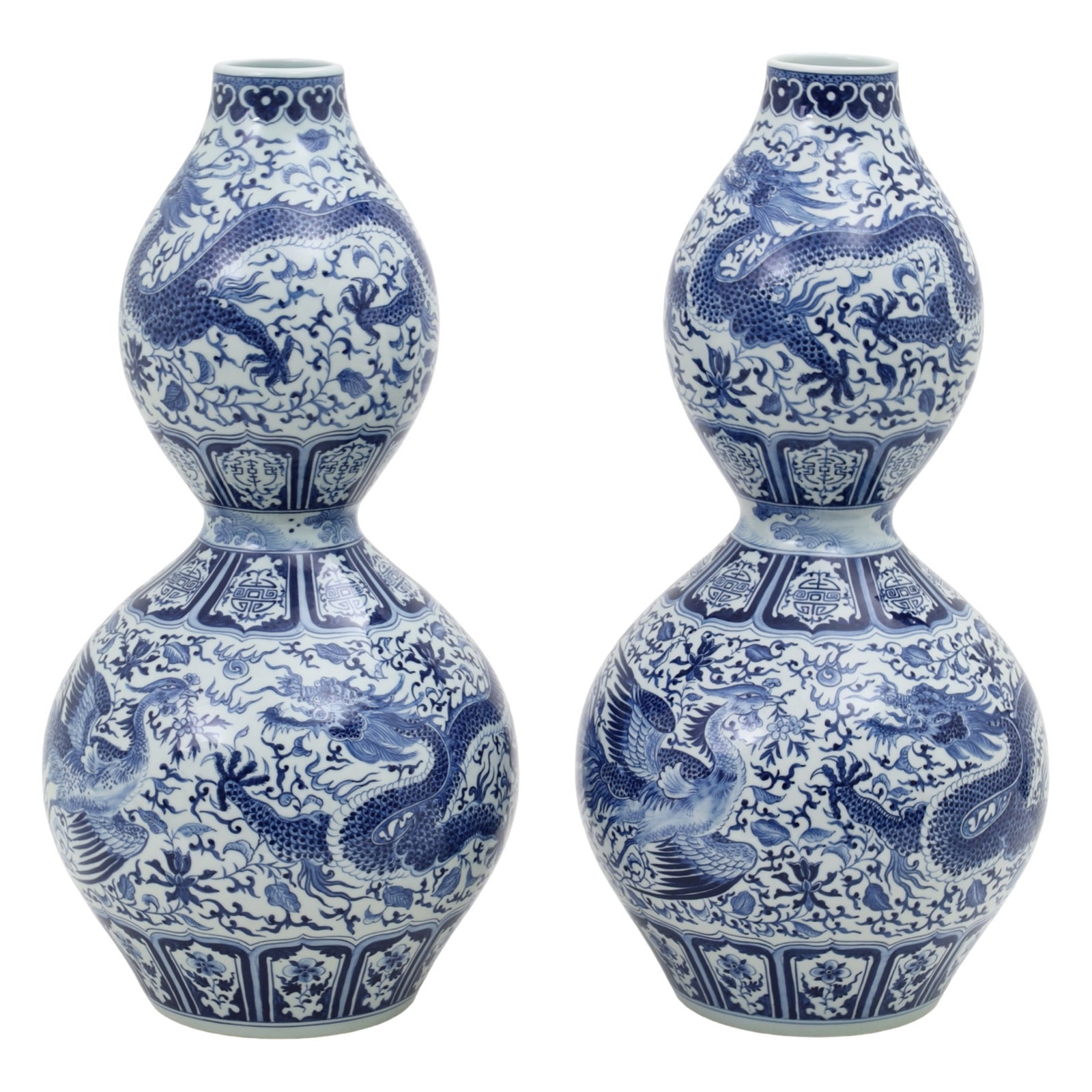 PR CHINESE DOUBLE GOURD VASES: Large pair of Chinese blue and white porcelain double gourd vases featuring dragon and phoenix motifs, 20th century; 24"H 6"base