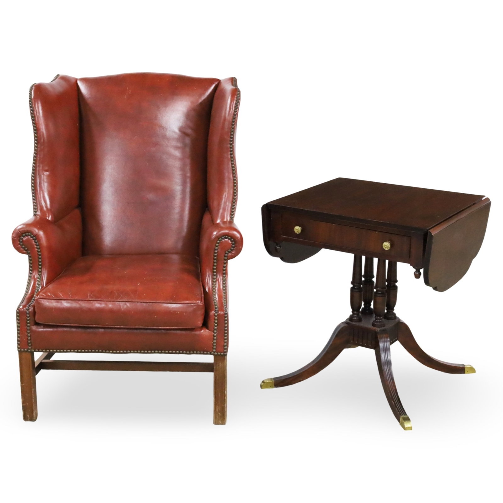 LEATHER WINGBACK ARMCHAIR AND PEMBROKE TABLE: George III style leather wingback armchair along with a Duncan Phyfe influence mahogany pembroke, 20th century; chair 44"H 30"W 21"D table 28"H 26"W 22"D