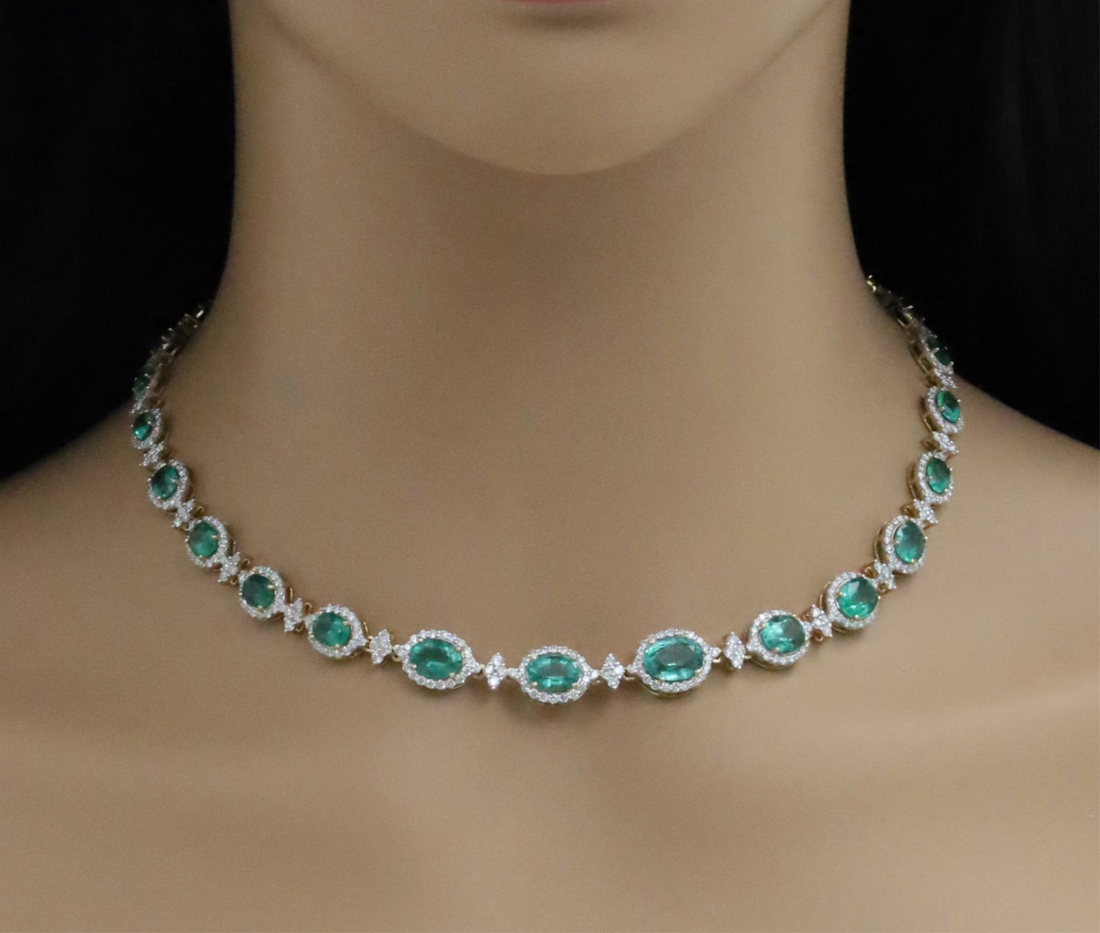 14K EMERALD AND DIAMOND NECKLACE: 14k yellow gold emerald and diamond necklace having 18.25cts of oval emeralds and 7.90cts of diamonds . total weight is 32.9grams. Please see all photos and appraisaled value of $62270. Note:this lot
