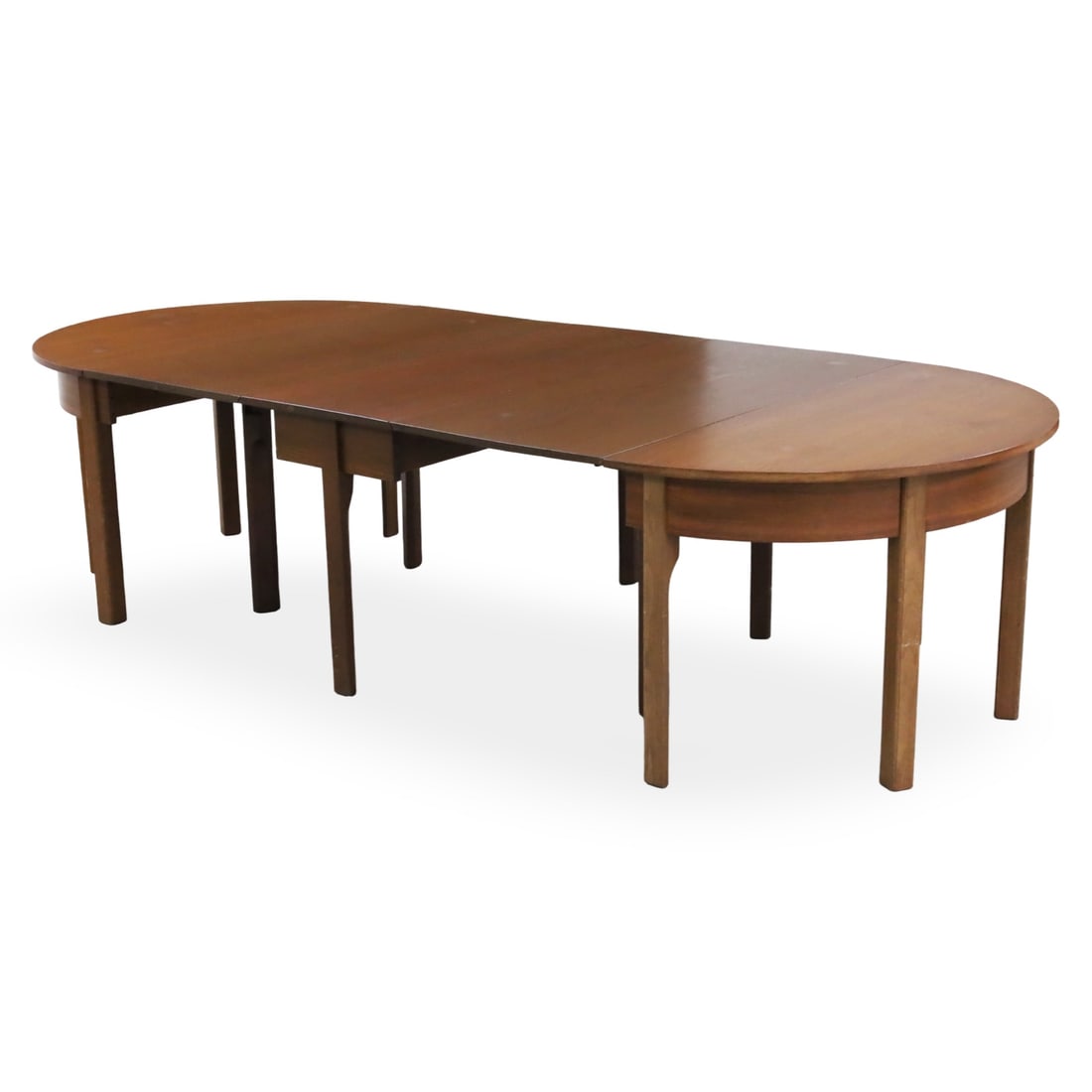 VICTORIAN MAHOGANY BANQUET TABLE: Victorian-style mahogany "D-end" extending dining table, which features demilune end sections and typically includes a central drop-leaf section supported by square tapered leg, accompanied by one